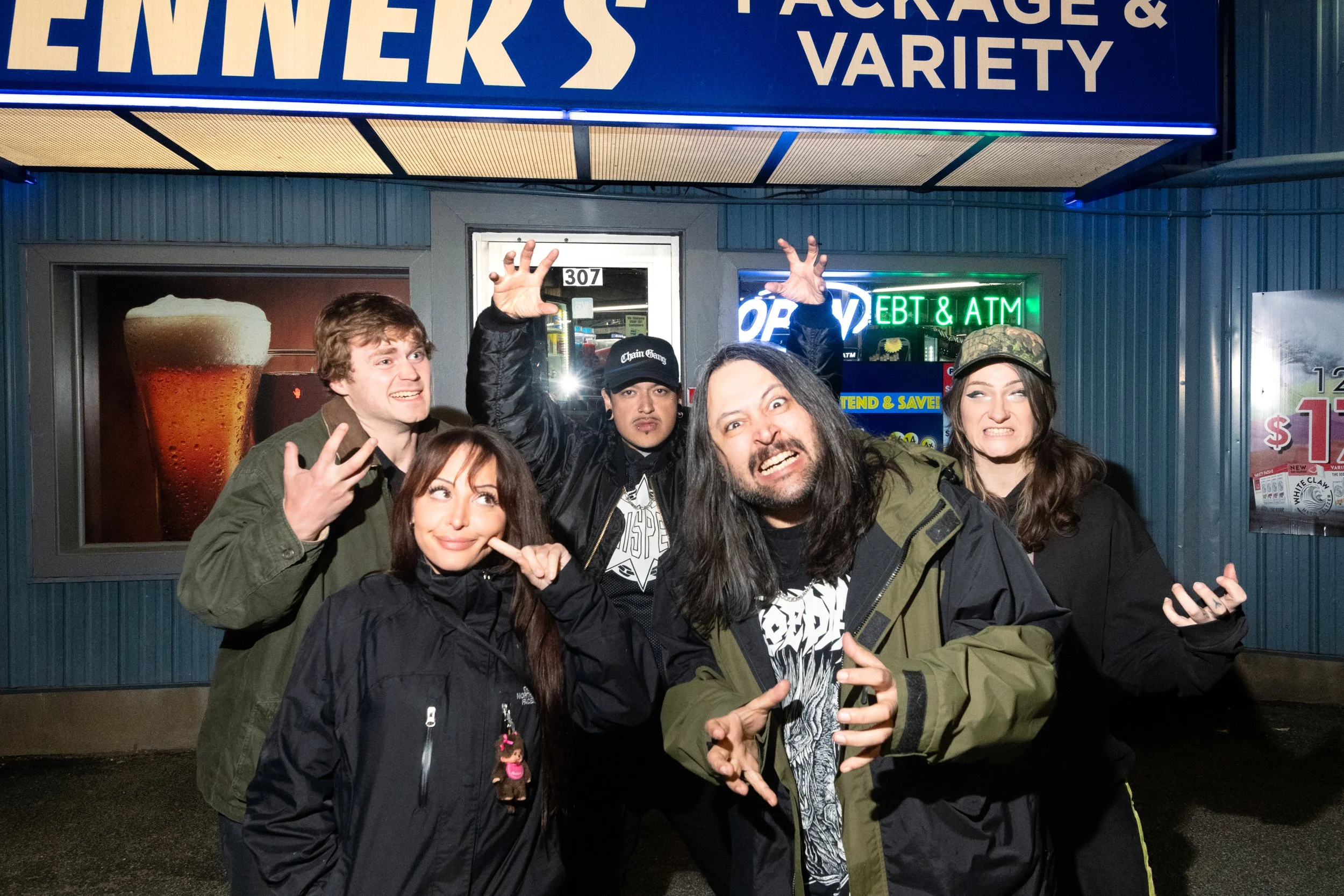 The five members of Escuela Grind outside the Package & Variety store