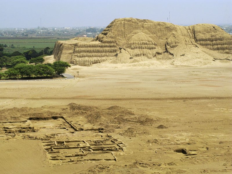 Huaca del Sol with city ruins in front