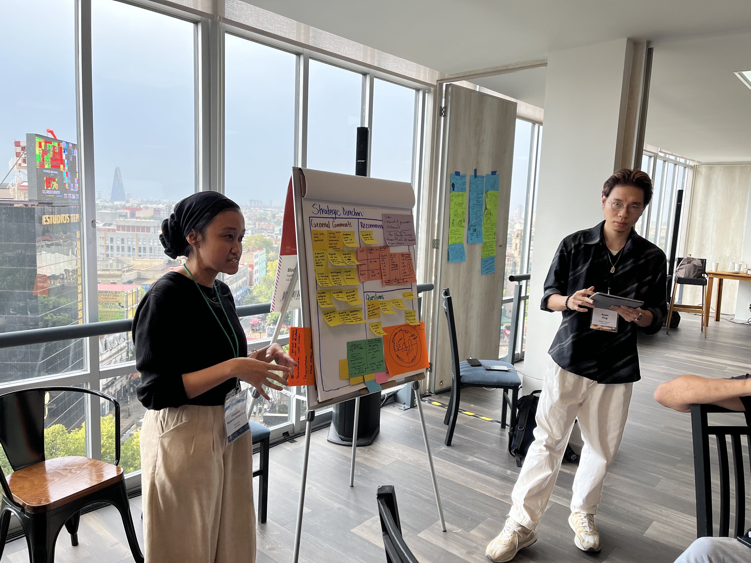   Fildzah Husna from Kota Kita in Indonesia (left) facilitates a strategic-planning discussion with the new People Powered communications coordinator, Ryan Ong (based in Malaysia).   