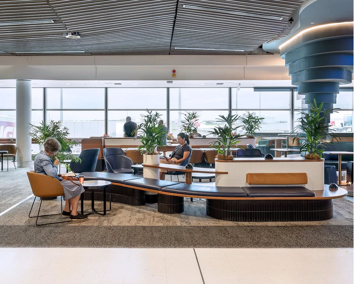 Modern airport lounge with seating and plants. Brisbane Airport Domestic Terminal. Retail Interior Design Brisbane Australia