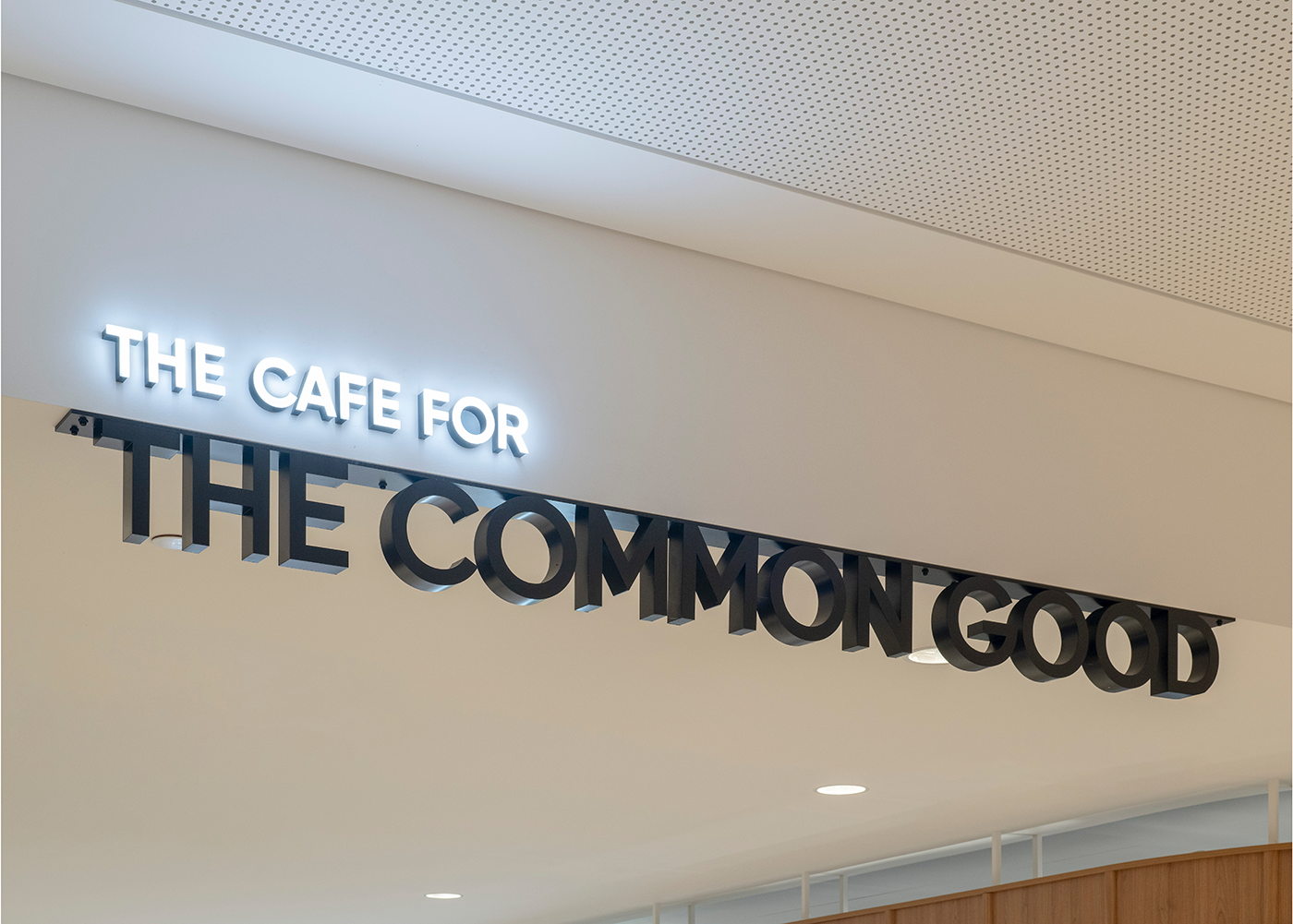 Prince Charles Hospital Foundation Common Good Cafe. Sign reading 'The Cafe for the Common Good' inside a building. Food and beverage Interior Design Brisbane Australia