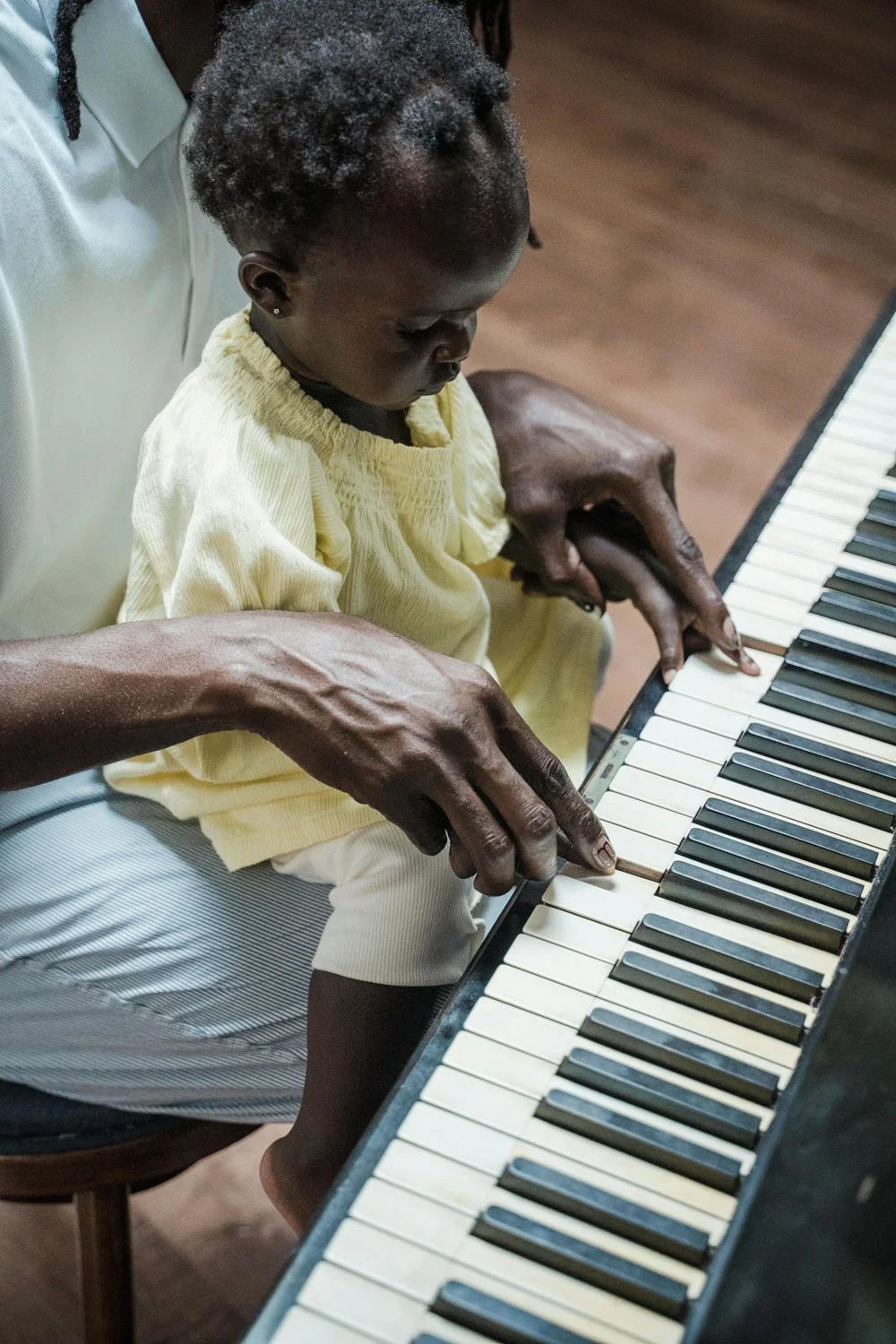 Baby plays piano with dad in portland