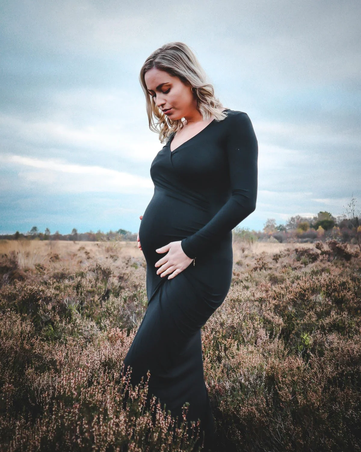 Portland maternity photoshoot in nature with woman wearing long dress
