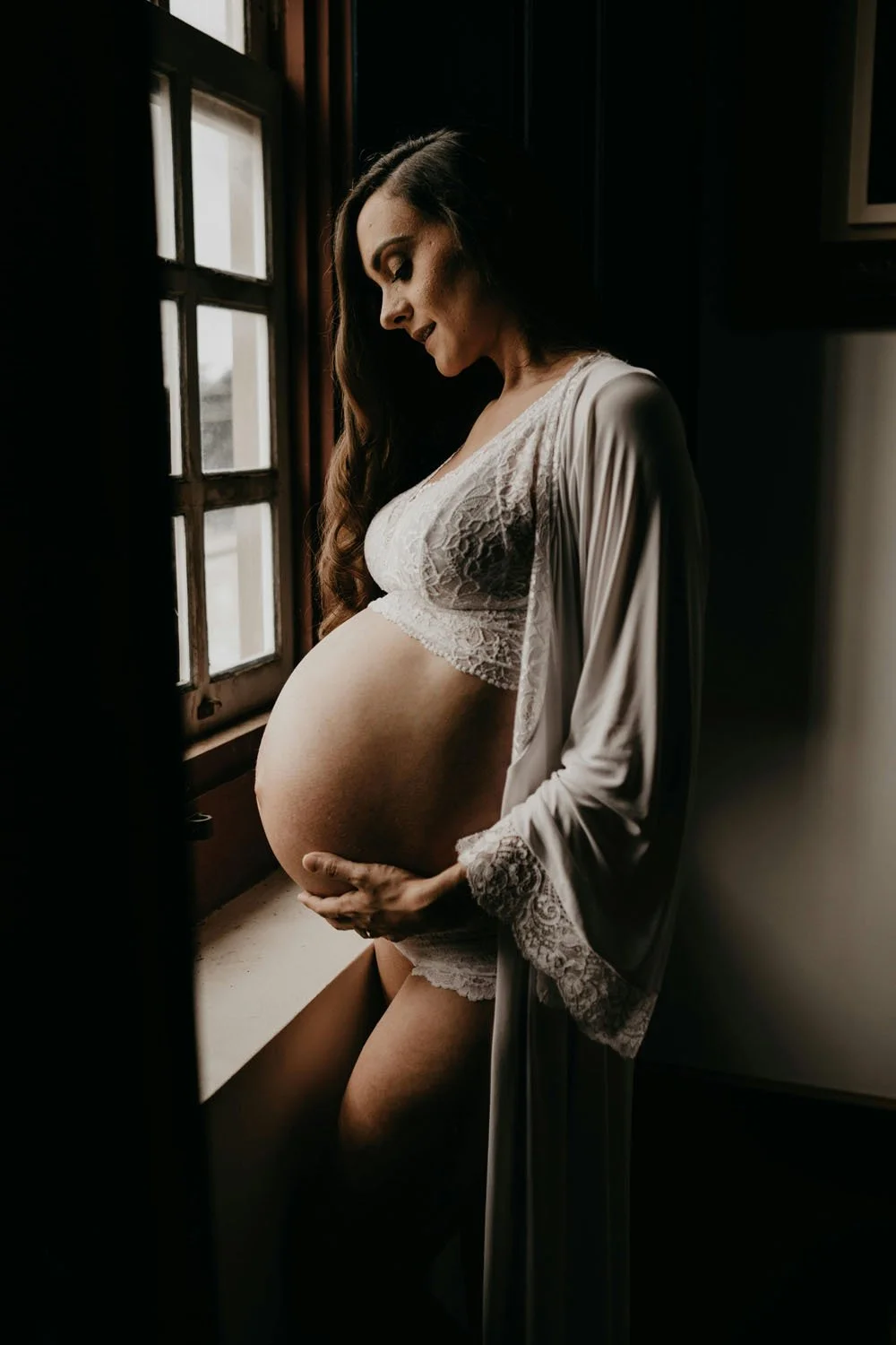 Artistic maternity photoshoot in lacey underwear