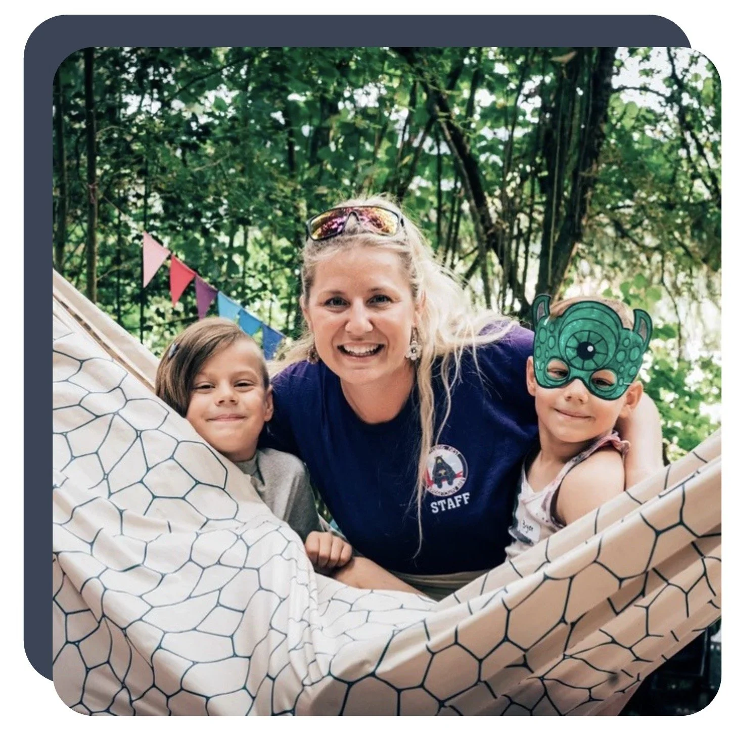 Woman and two children smiling from a hammock at Pickathon 2026