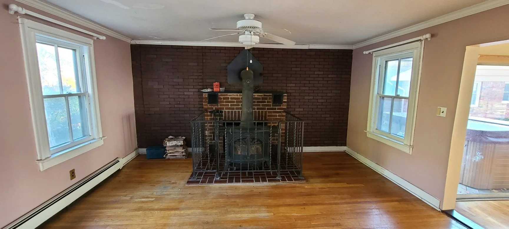 Den Before with wood burning stove.jpeg