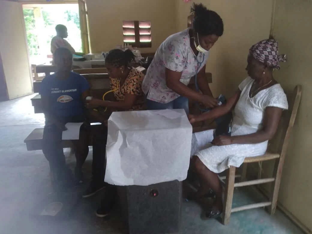 Nurses taking blood pressure
