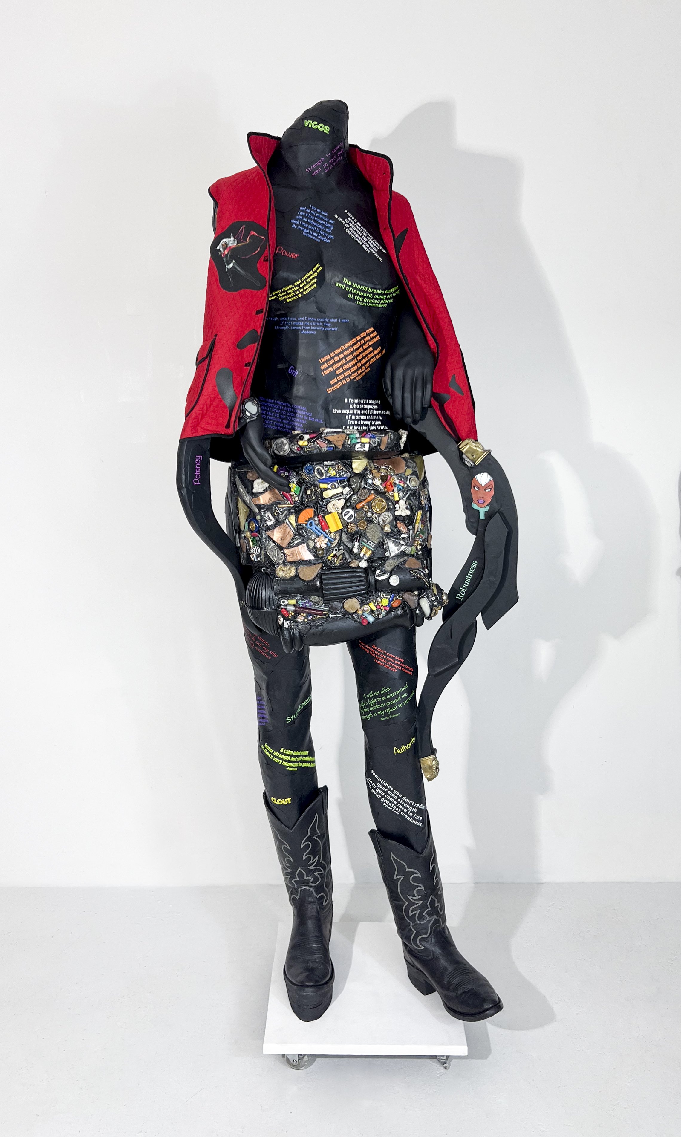   Warrior Waging Peace: Addressing Strength 1284 
 2025; 73” x 26” x 19”; wood, metal, water-based paint, archival pigment on canvas, found objects, epoxy, mixed media 