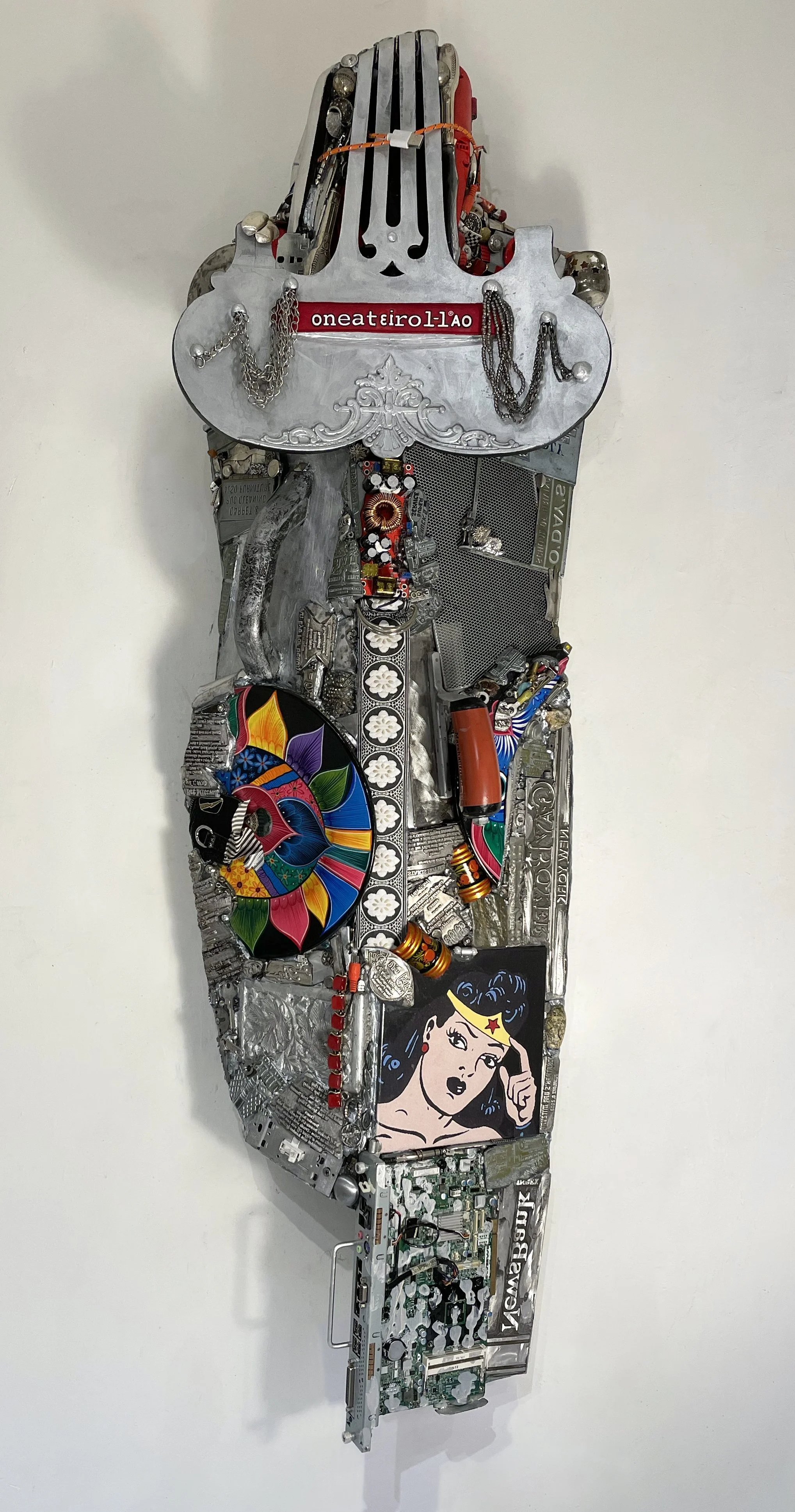   Wordplay 1296 
 2026; 54” x 17.5” x 8”; wood, metal, ceramic, plastic, mixed media 