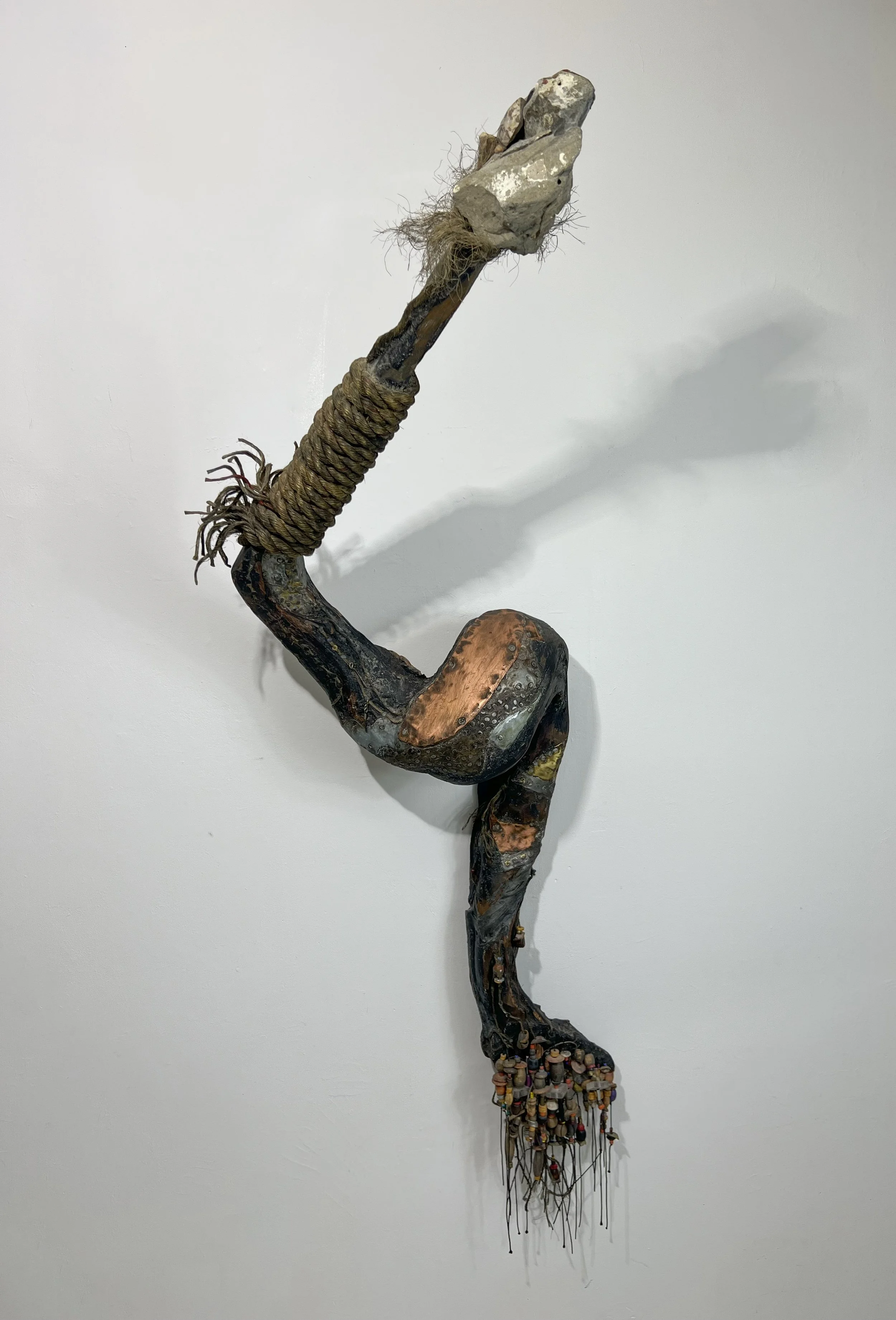   Intrigue 175 
 1988; 67" x 27" x 23"; wood, metal, stone 