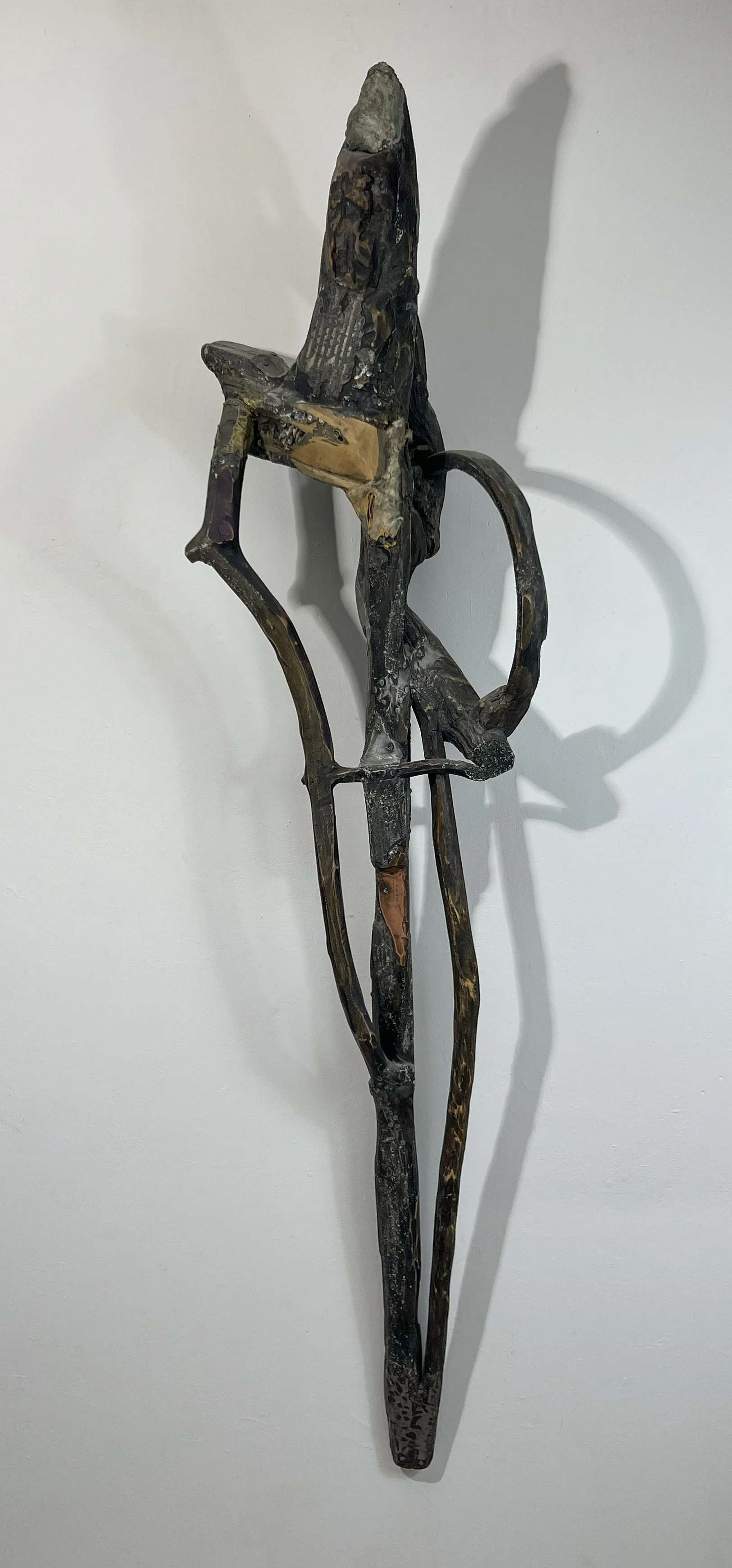  Triumph 174 
 1988; 74" x 26" x 23"; wood, metal, stone  