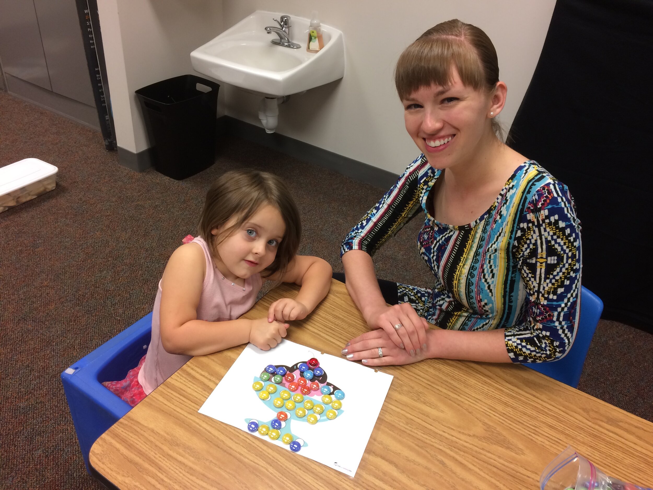 Holly Schlautman with Child at Lincoln Clinic 07.2017.jpg
