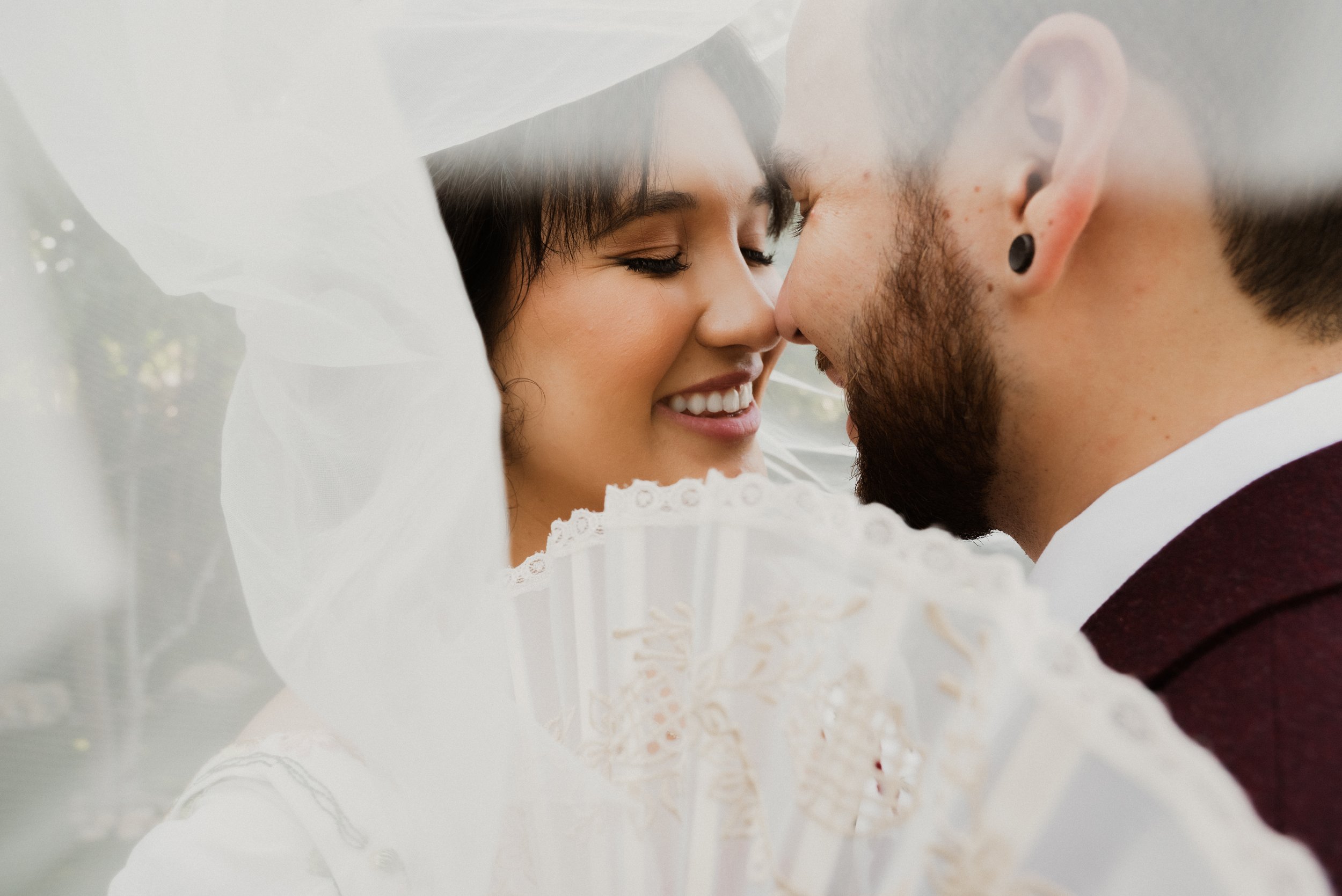 bride and groom kissing after wedding ceremony