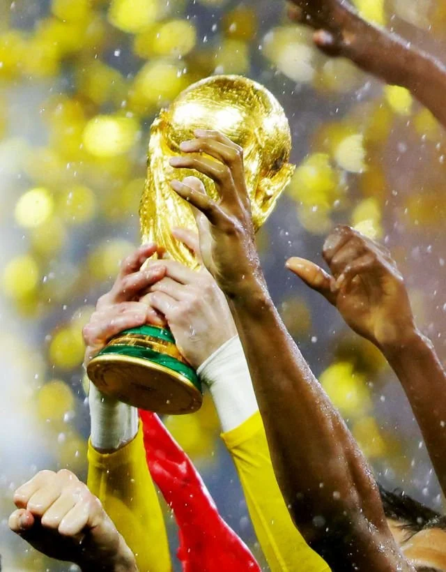 Football fans celebrating during the FIFA World Cup, the global tournament that unites billions through a shared love of the game.