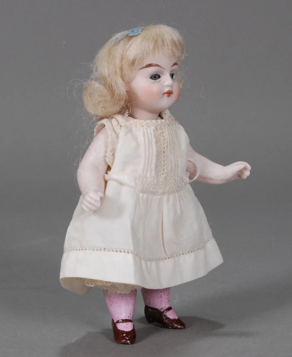 Lot 305 - A Kestner 208 all-bisque dolls’ house doll