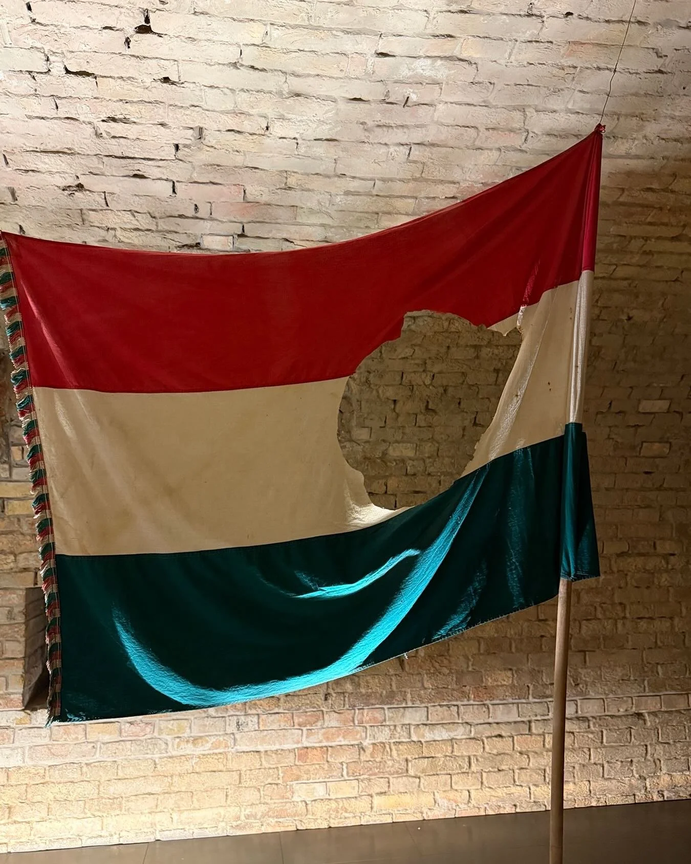 The Hungarian Flag during the 1956 Revolution&hellip; The hole is where the cut out the evil Soviet Communist Hammer and Sickle! A truly amazing country, MAY HUNGARY ALWAYS BE FREE!! @orbanviktor