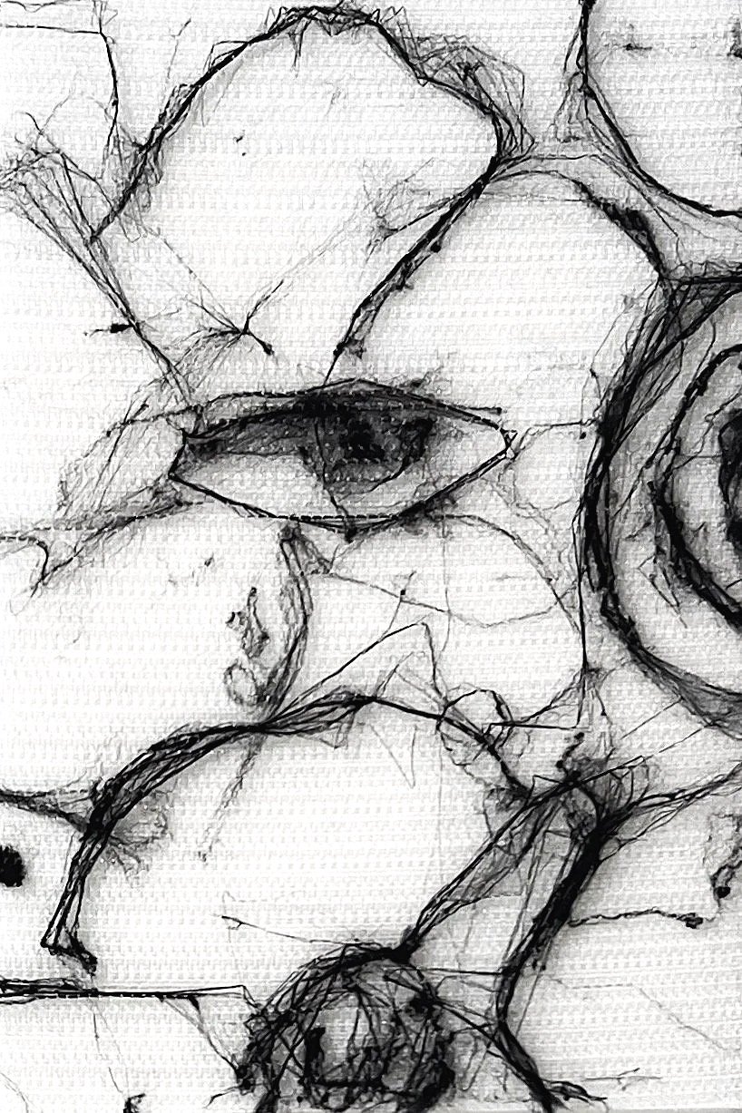 A black and white abstract sketch of a human eye surrounded by loose, overlapping lines and shapes.