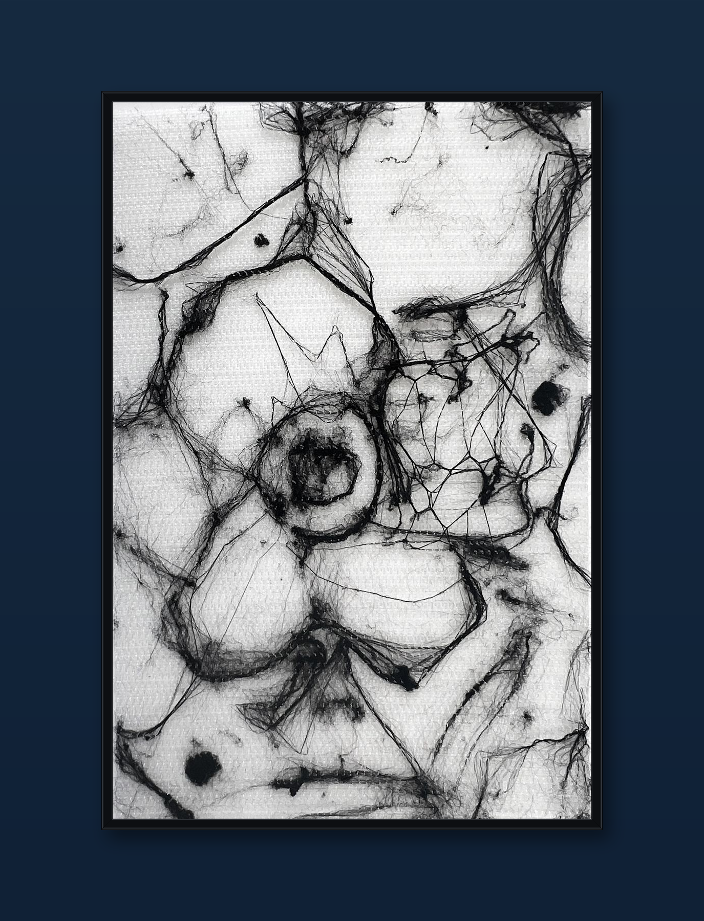 unity-puzzle-16-black-frame-navy-wall.png