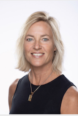 Headshot of a smiling blonde white woman