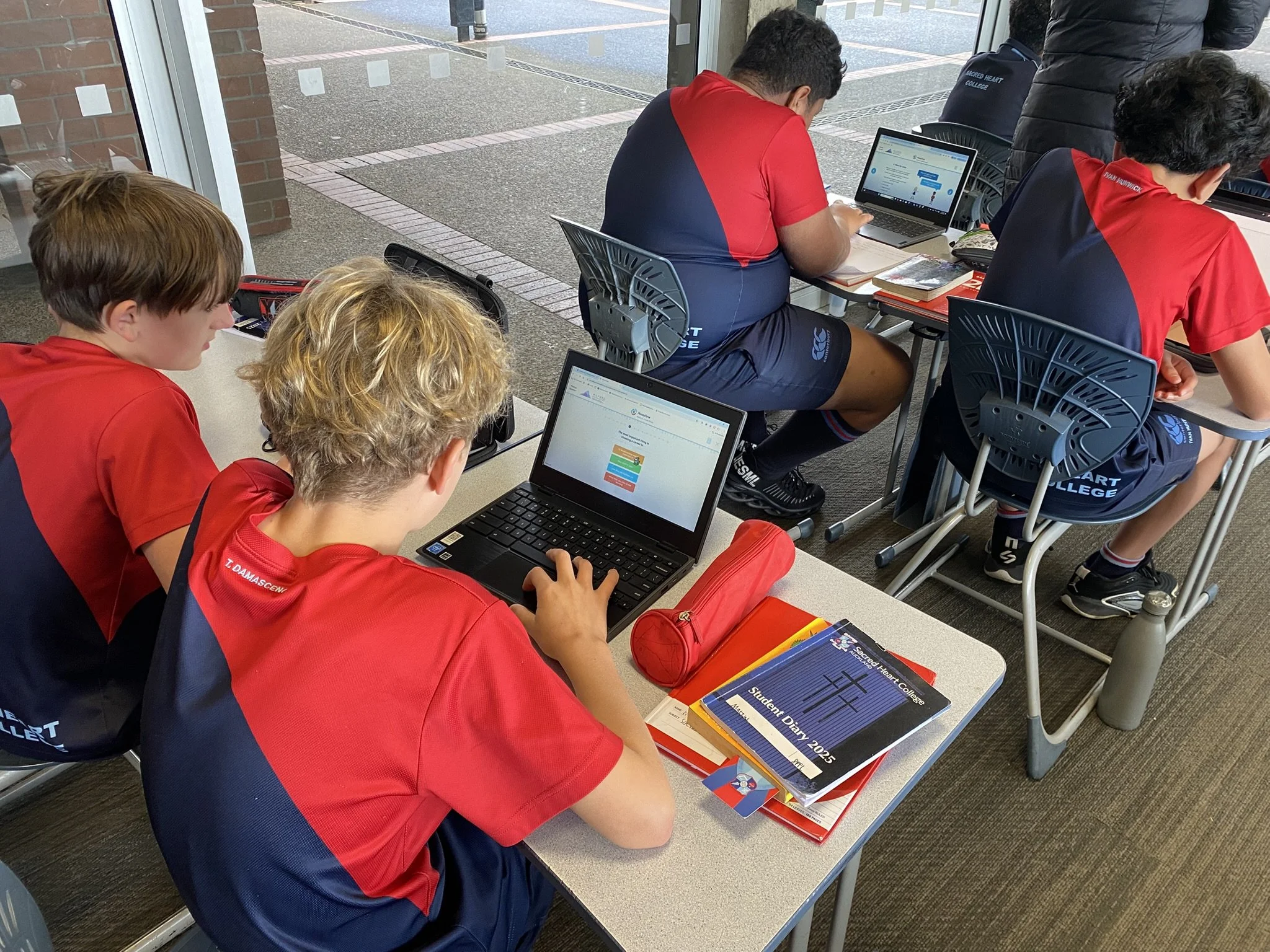 Students doing MoneyTime's financial literacy lessons