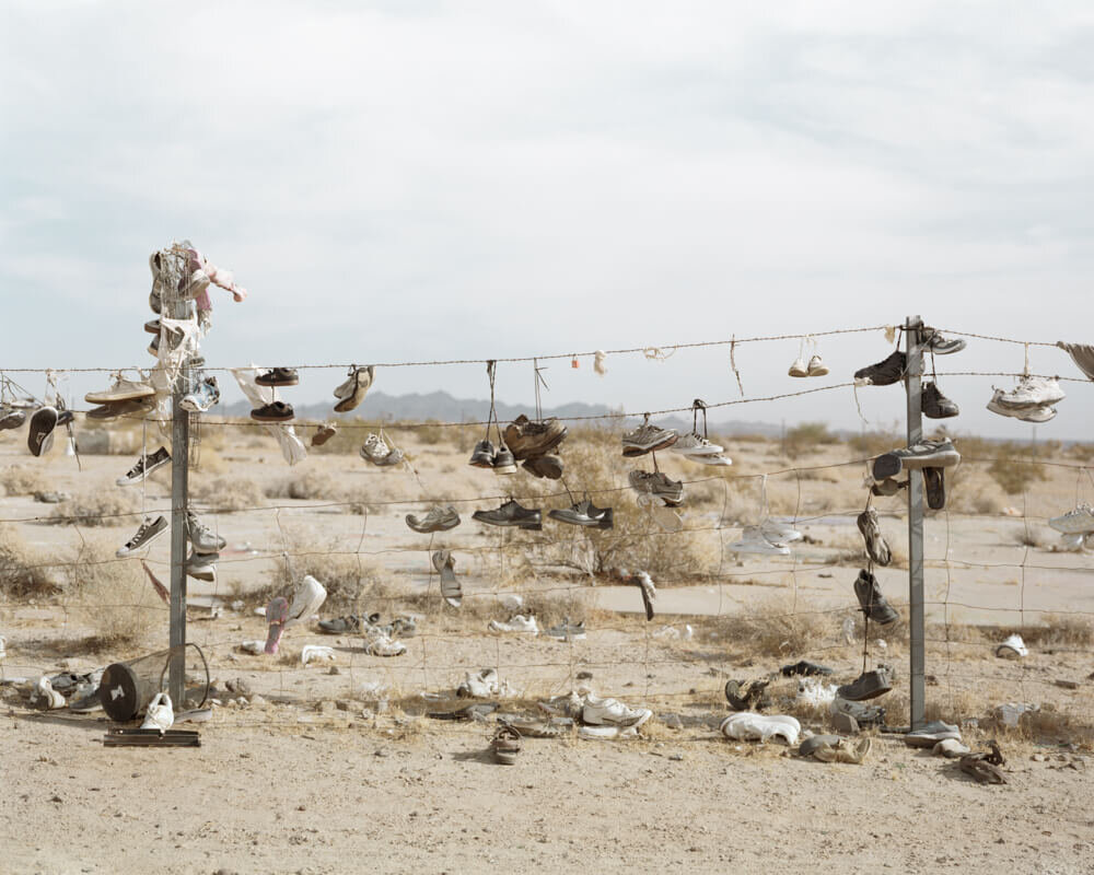  Shoes on Fence, 2021 Archival pigment print   Writing    Film    Installation  