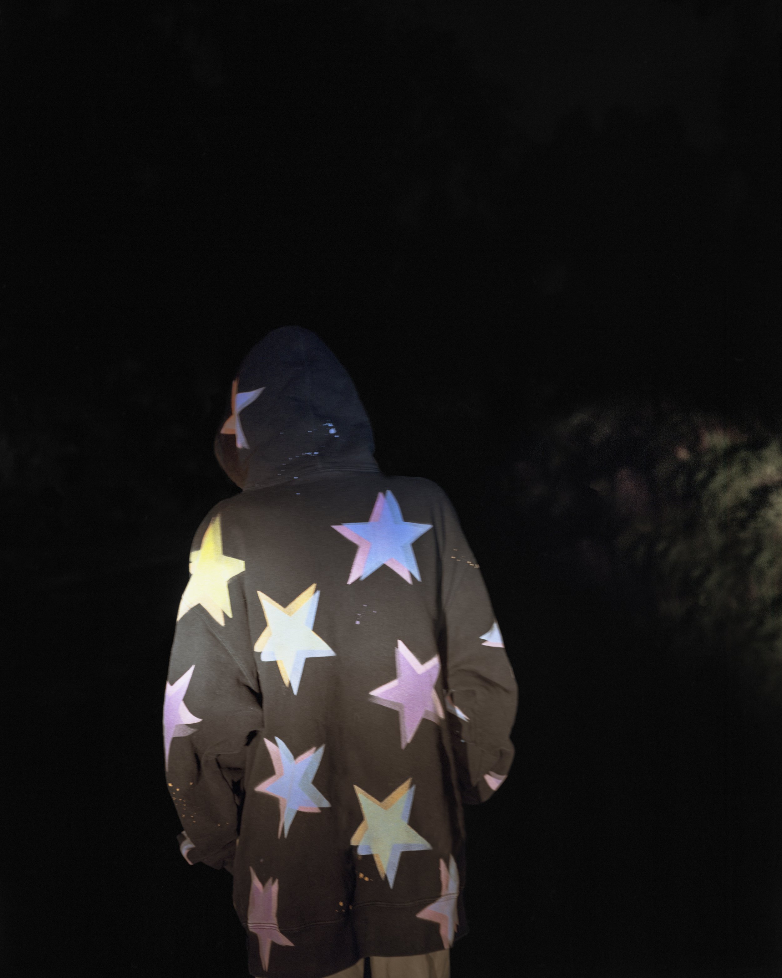  Eli with Star Hoody, 2021 Archival pigment print   Writing    Film    Installation  