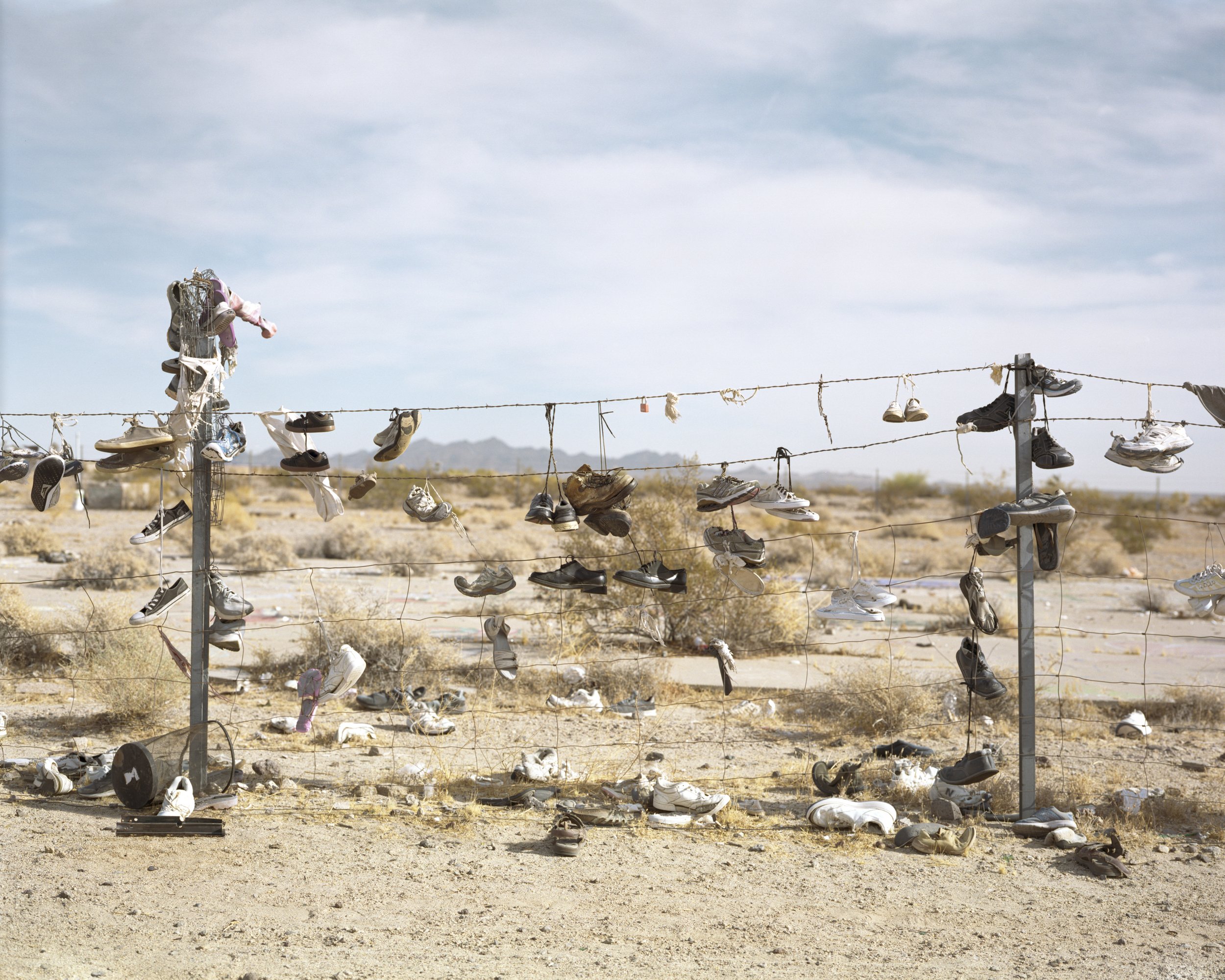  Shoes on Fence, 2021 Archival pigment print   Writing    Film    Installation  