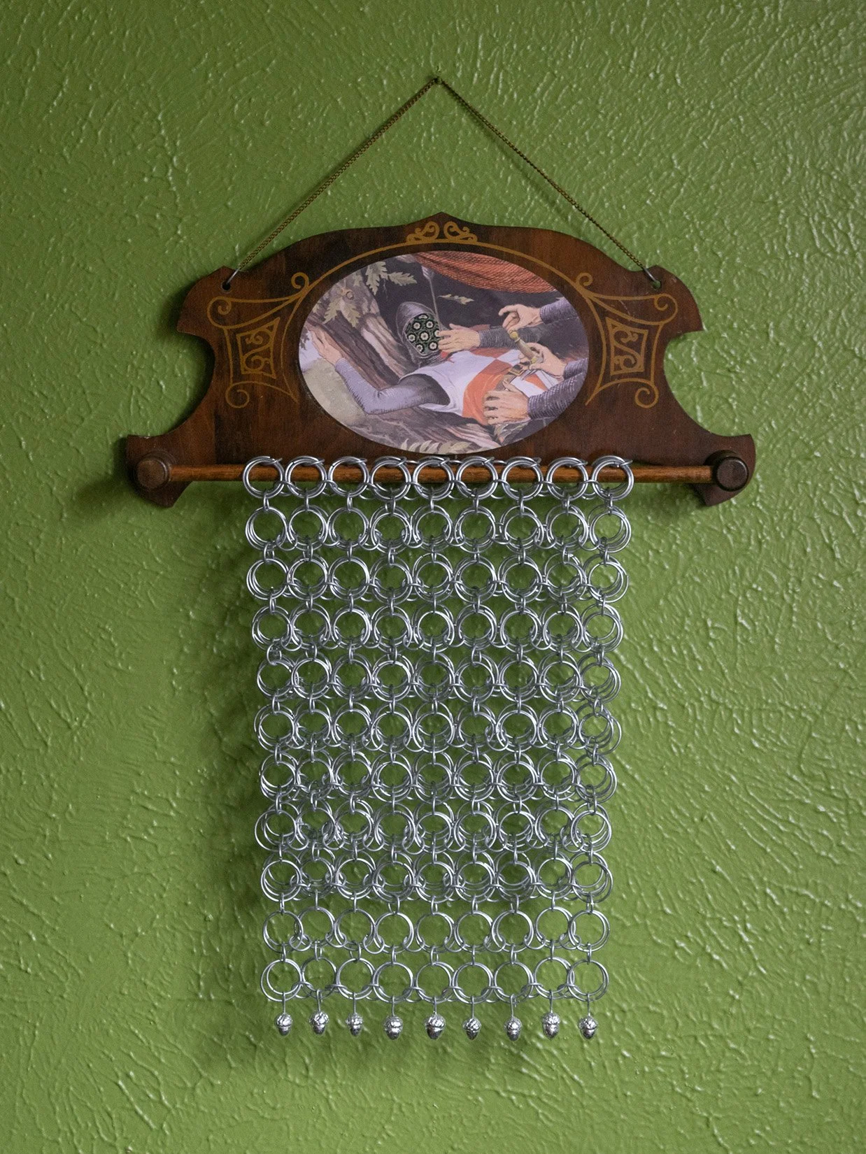 hilt /hĭlt/ : handle, guard, grip, pommel, 2025