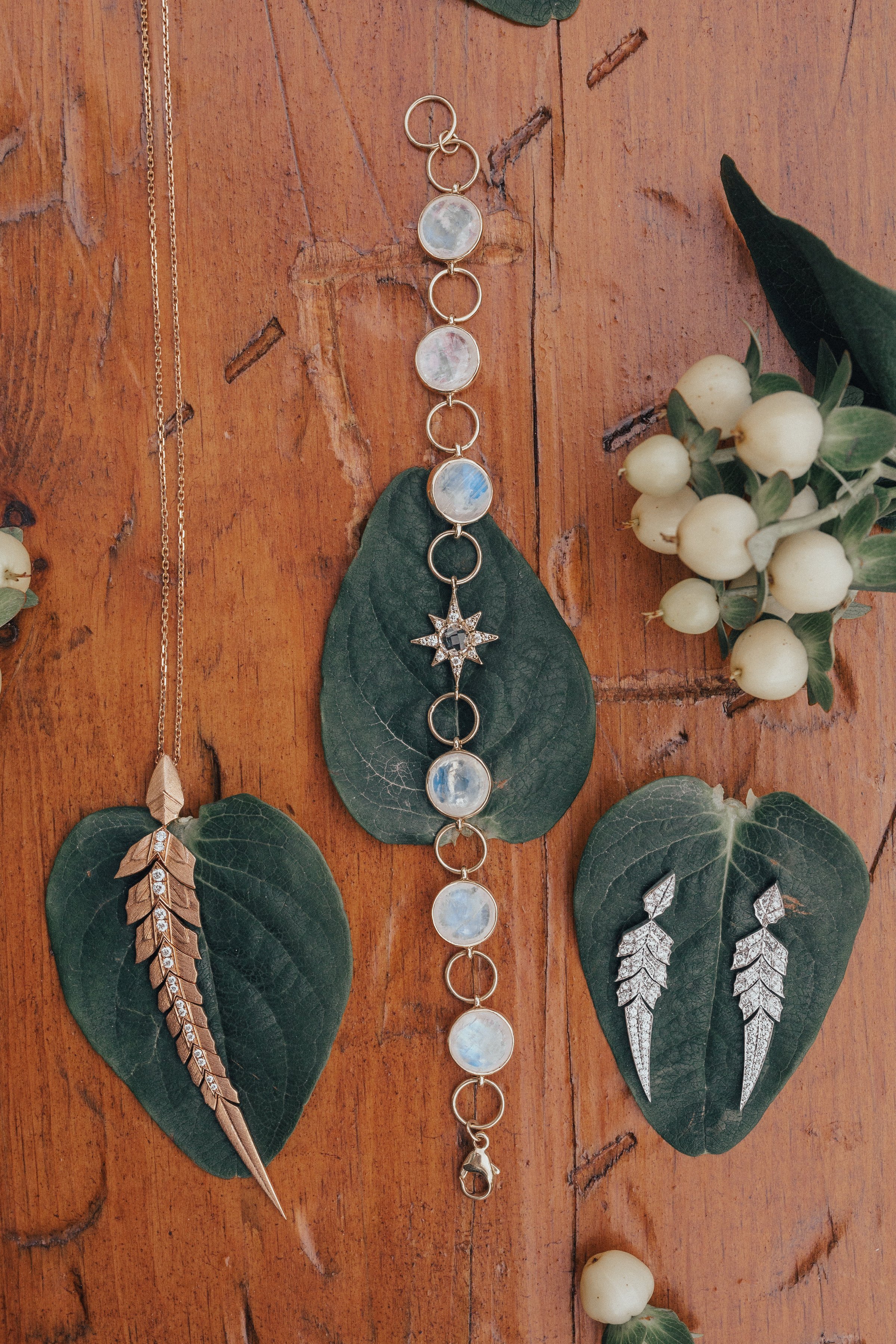 Bridal accessory flat lay, earrings, necklace, boho design, celestial, vintage inspired