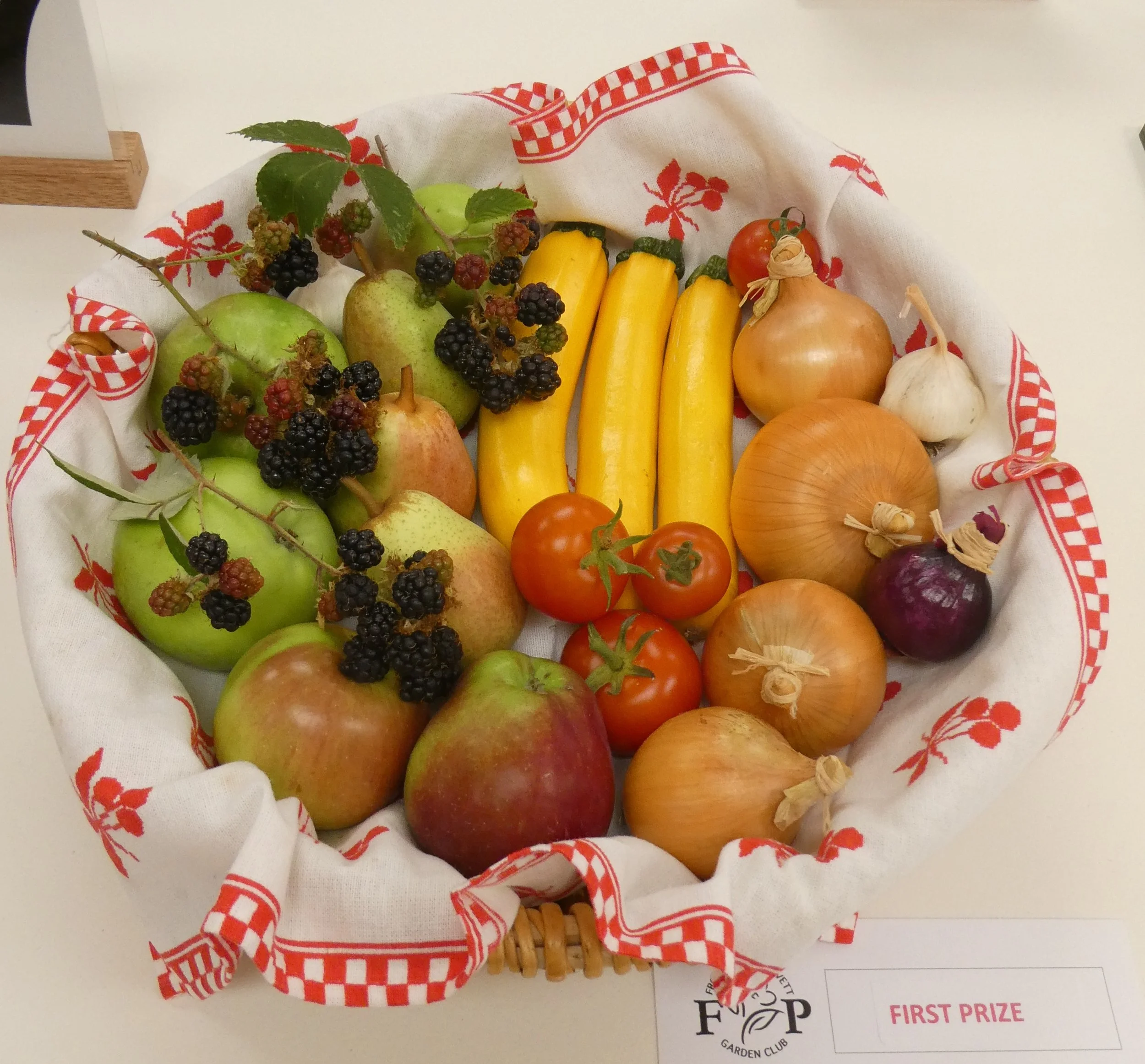 A basket of vegetables and fruit