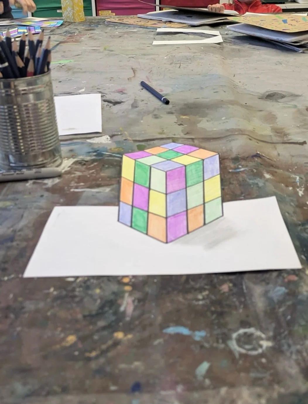 This week in @amandaturnerart Sketchbook Clubs they explored anamorphic illusions&hellip; and the results were incredible. Swipe through to see ⬅️

Using the humble Rubik&rsquo;s Cube as inspiration, the children created drawings that appear to pop r