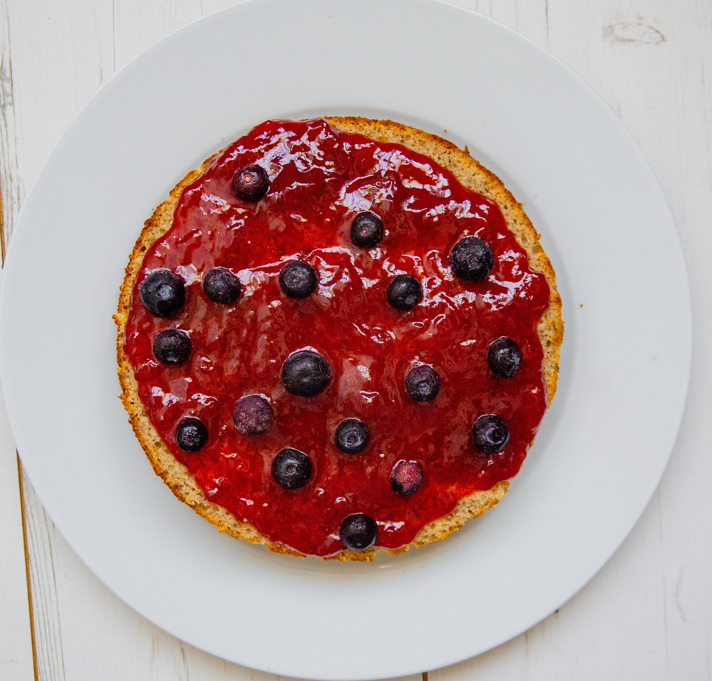 Cake layer with jam and berries 