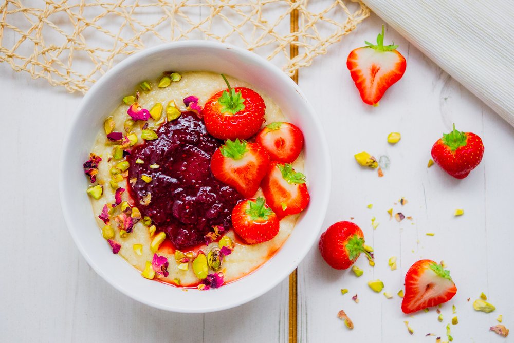 Millet porridge with berry chia jam &amp; pistachios