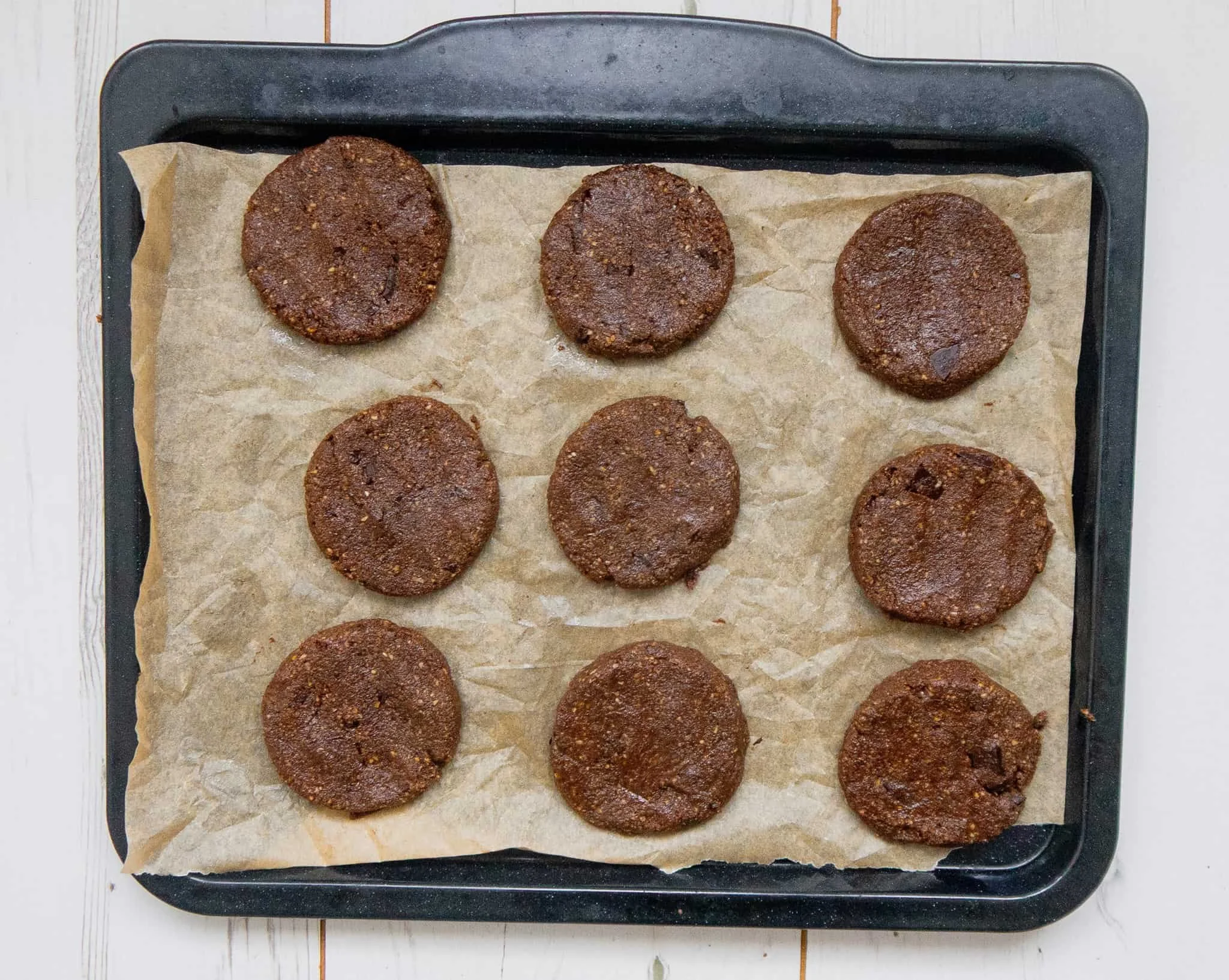 Double chocolate chip cookies on a baking sheet ready to be baked