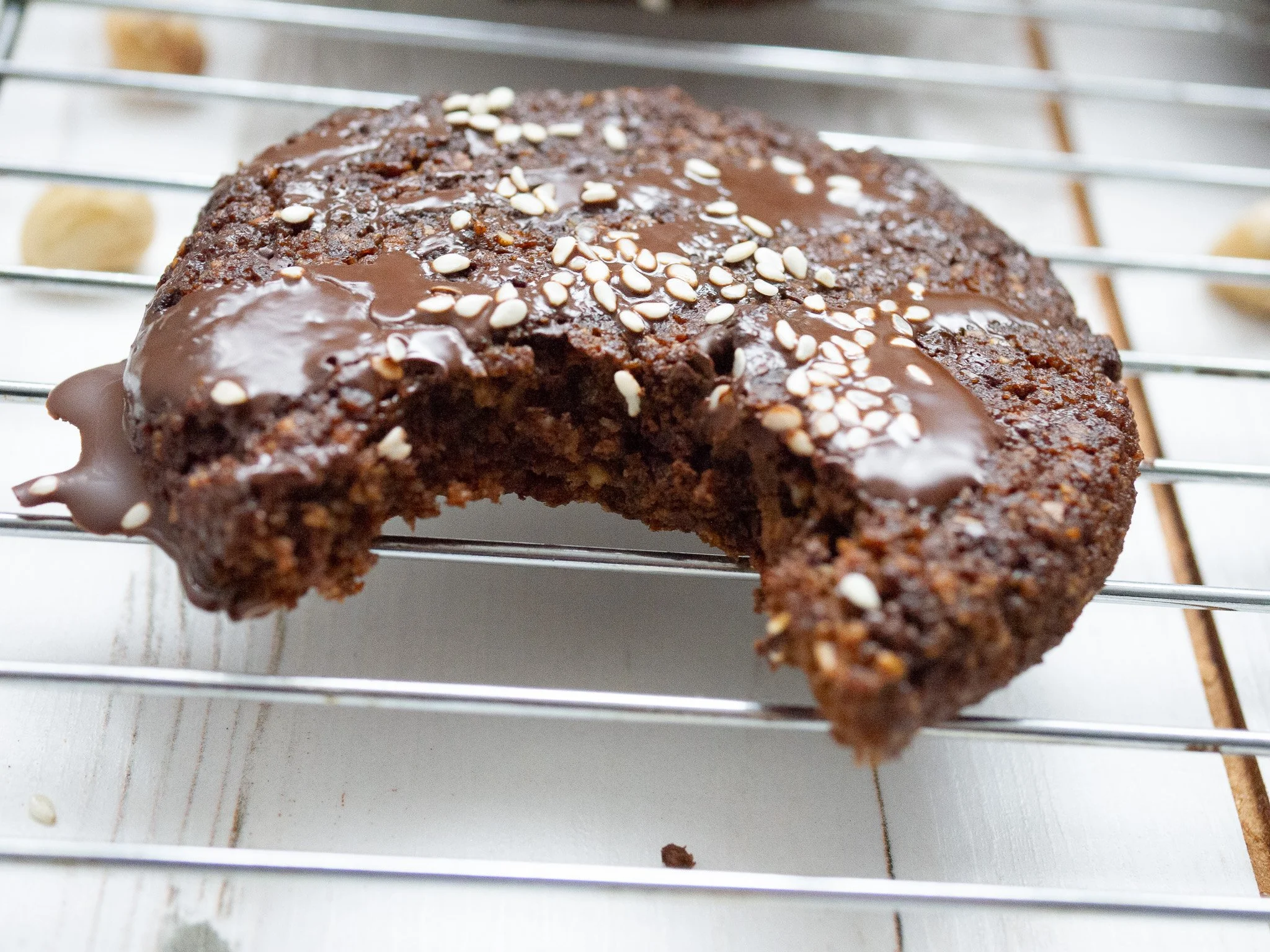 Double chocolate chip cookie with a bite taken out of it