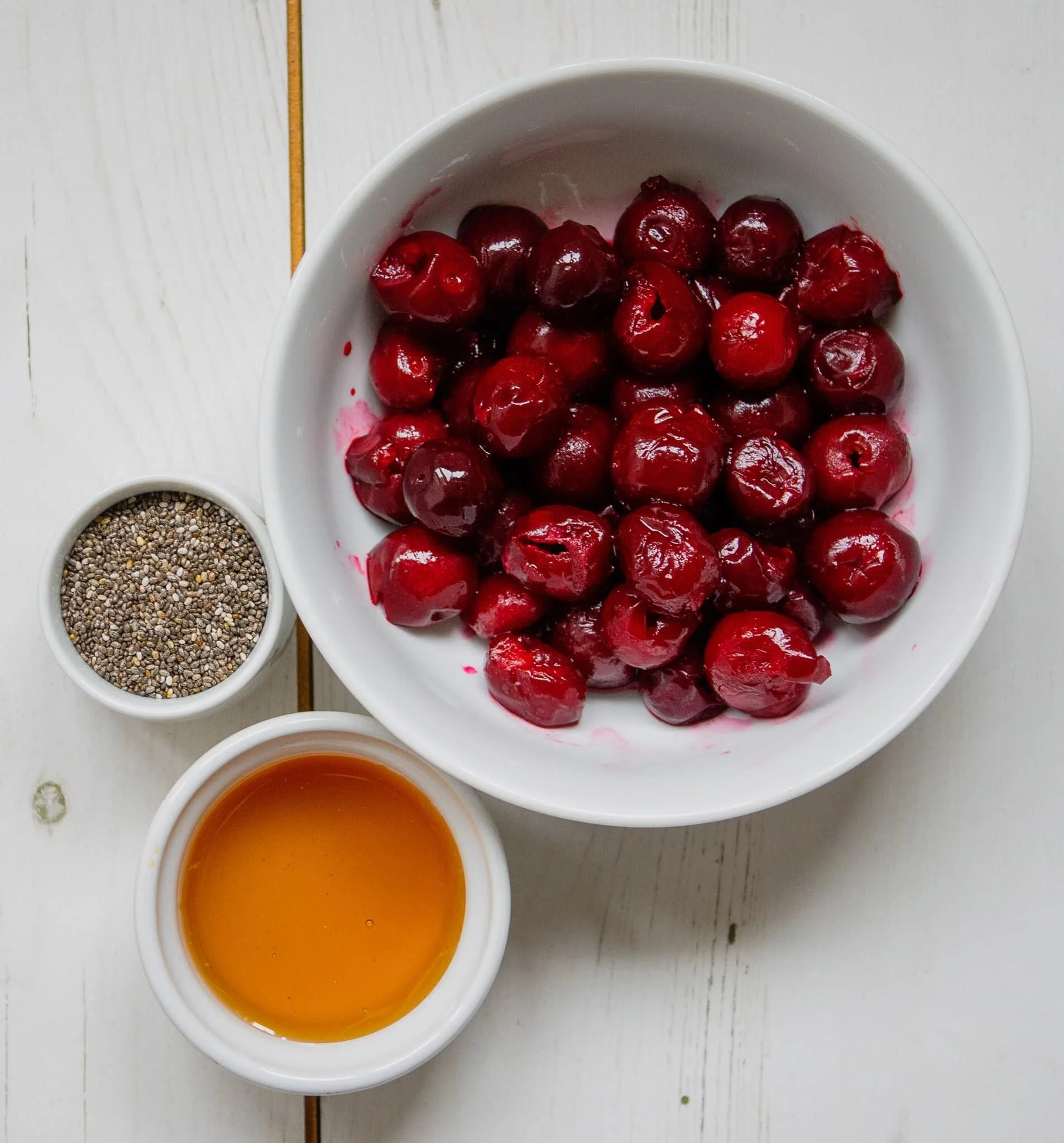 Gluten-free black forest granola breakfast bowl with chocolate and cherries