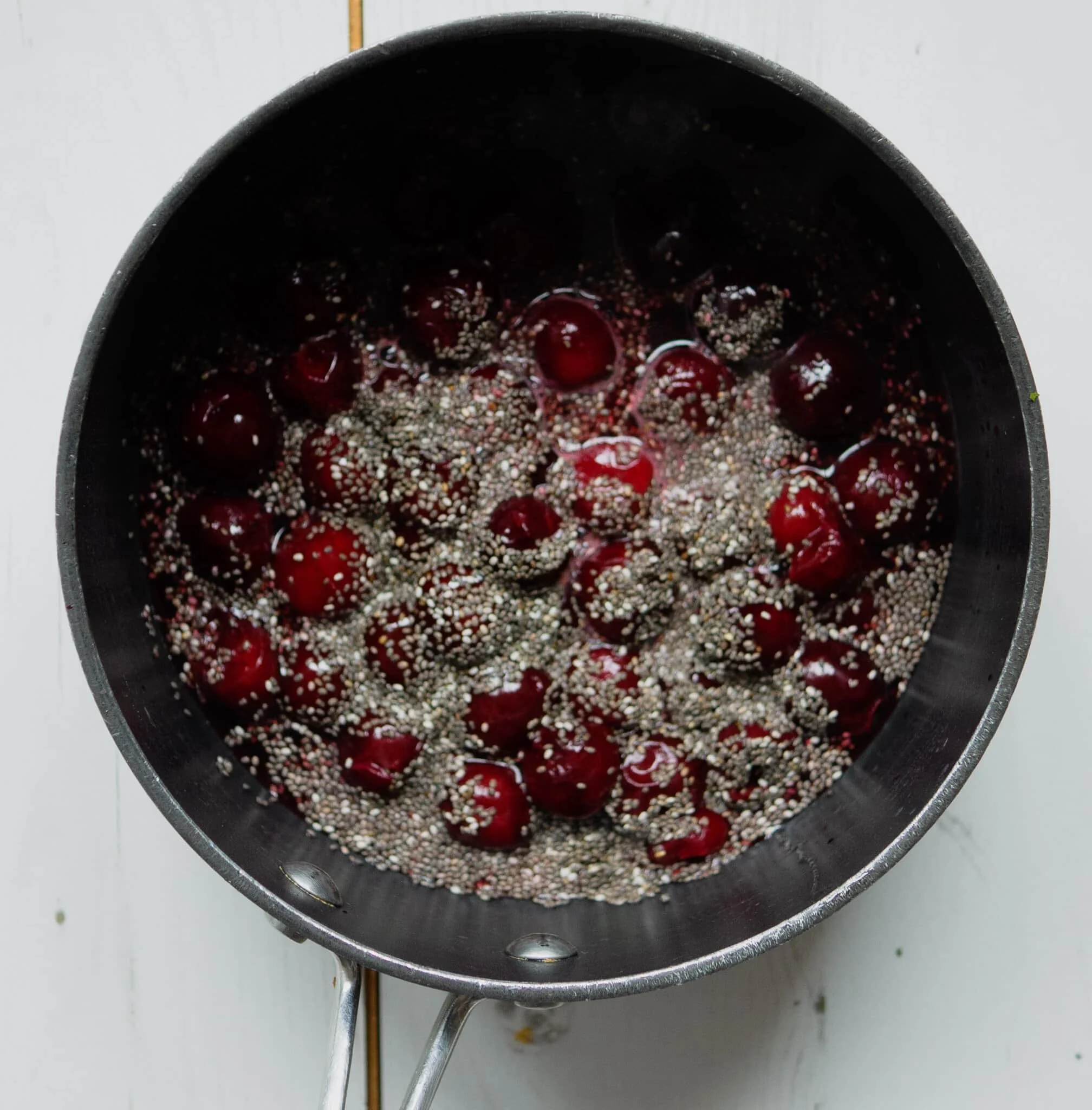 vegan breakfast bowl with chocolate granola and cherries