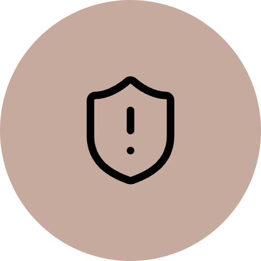 An icon of a shield with an exclamation mark in the center, symbolizing caution or warning.