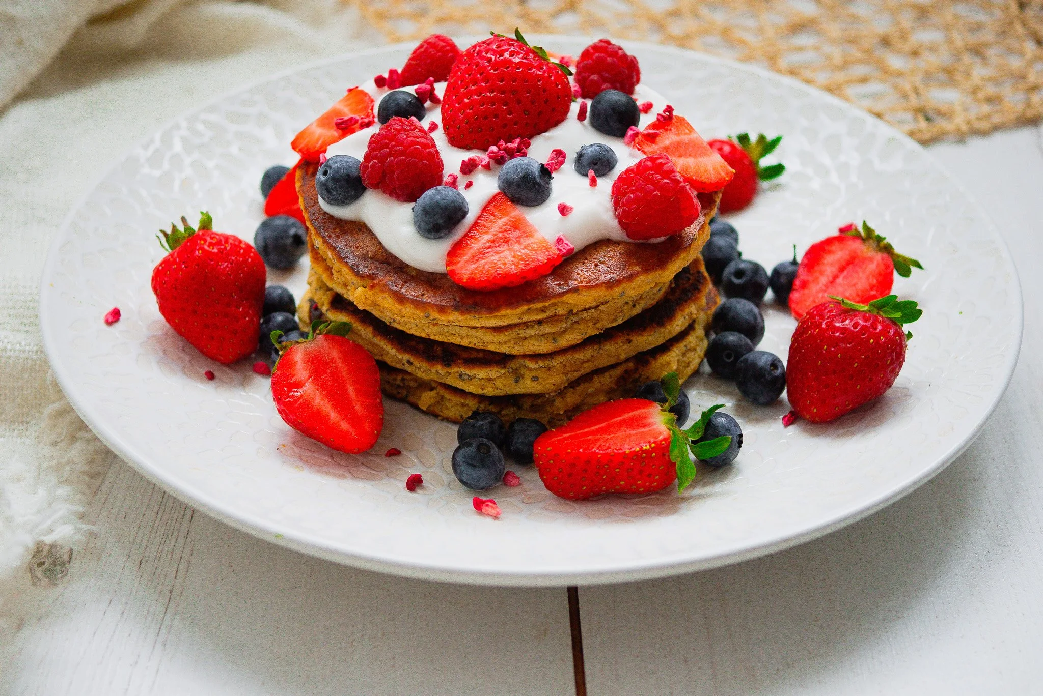 a picture of pancakes topped with beries and yoghurt suitable for a yeast free diet