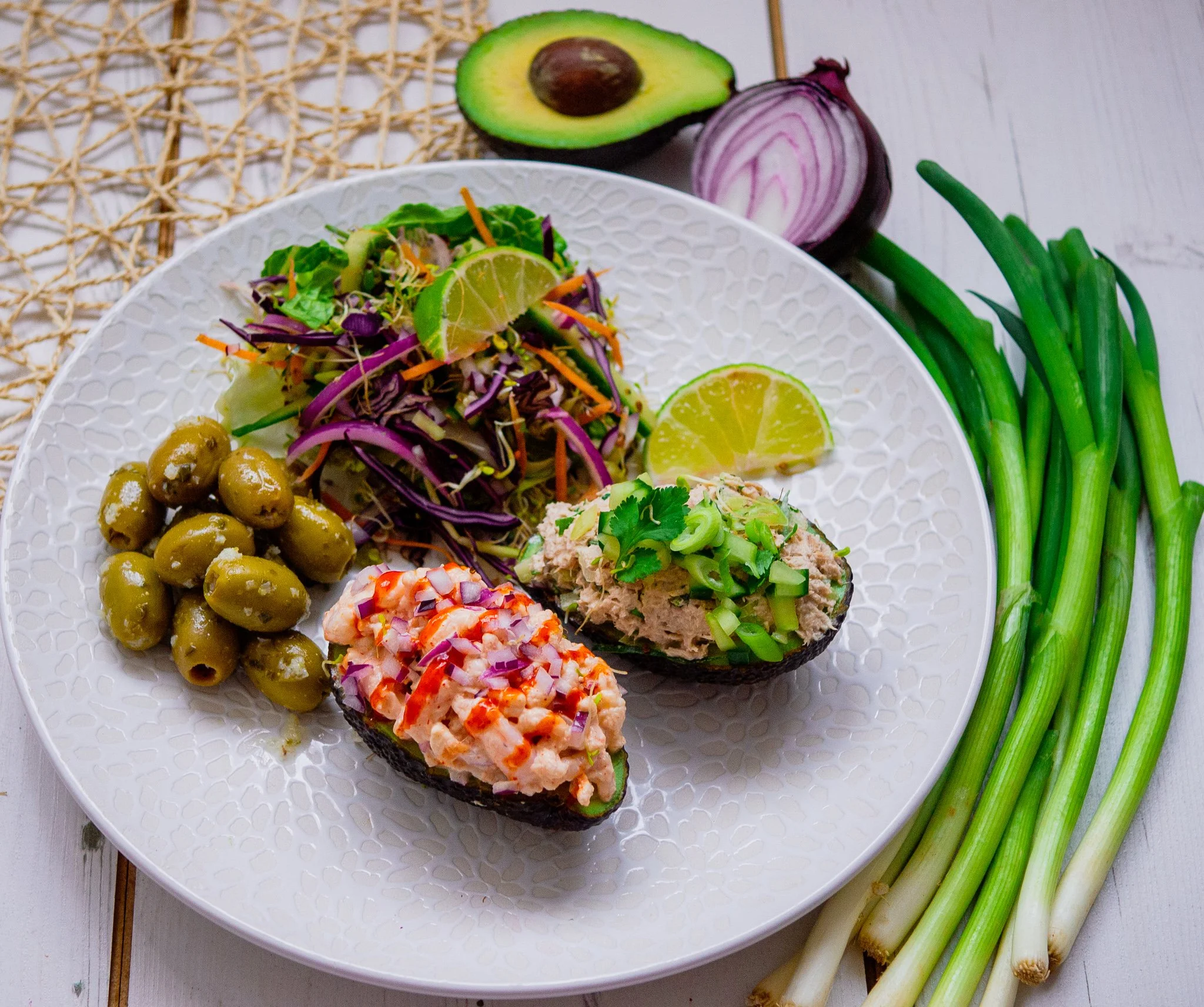 Spicy prawn cocktail and avocados filled with prawns and tuna and a side of olives