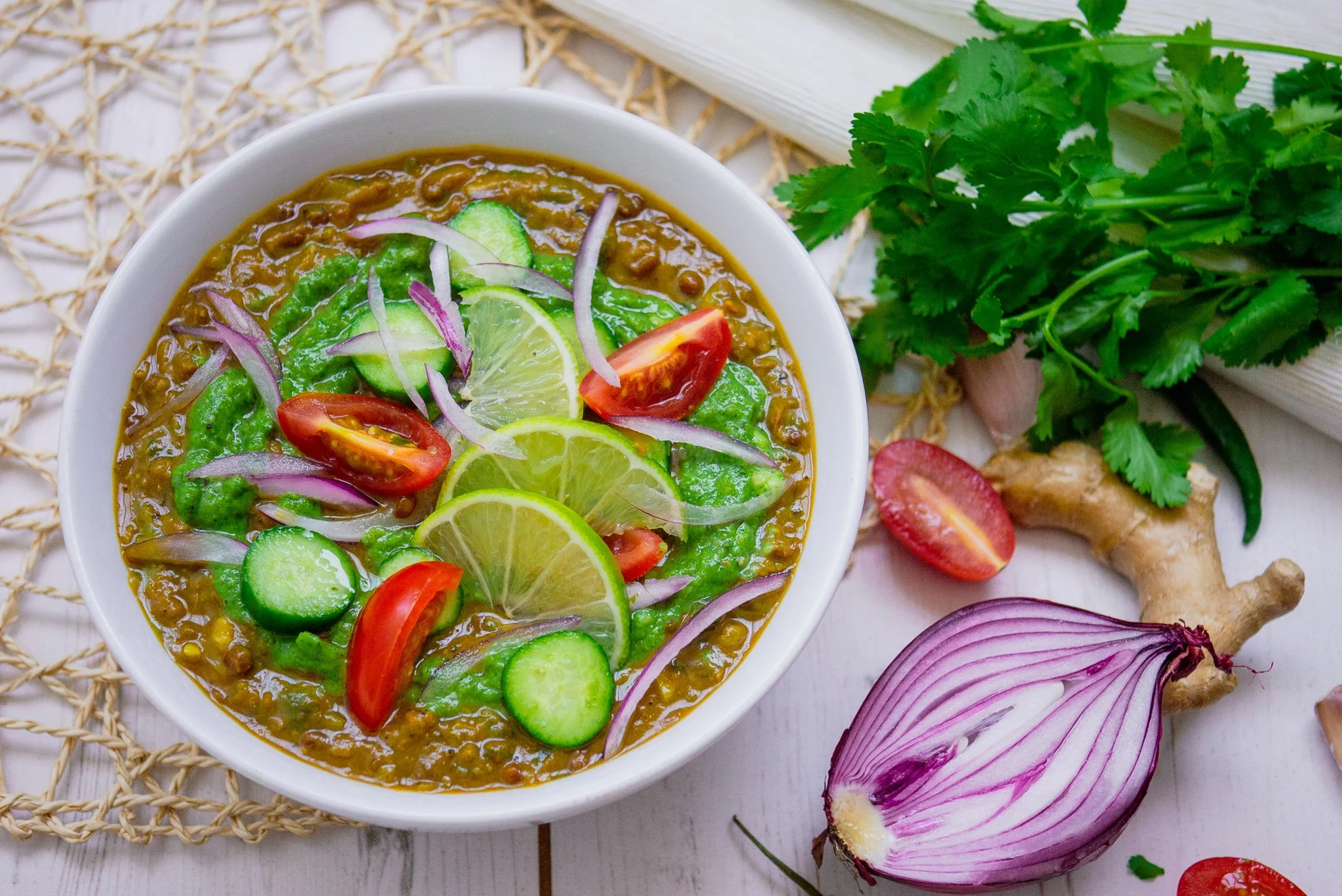 black lentil daal served in a white bowl