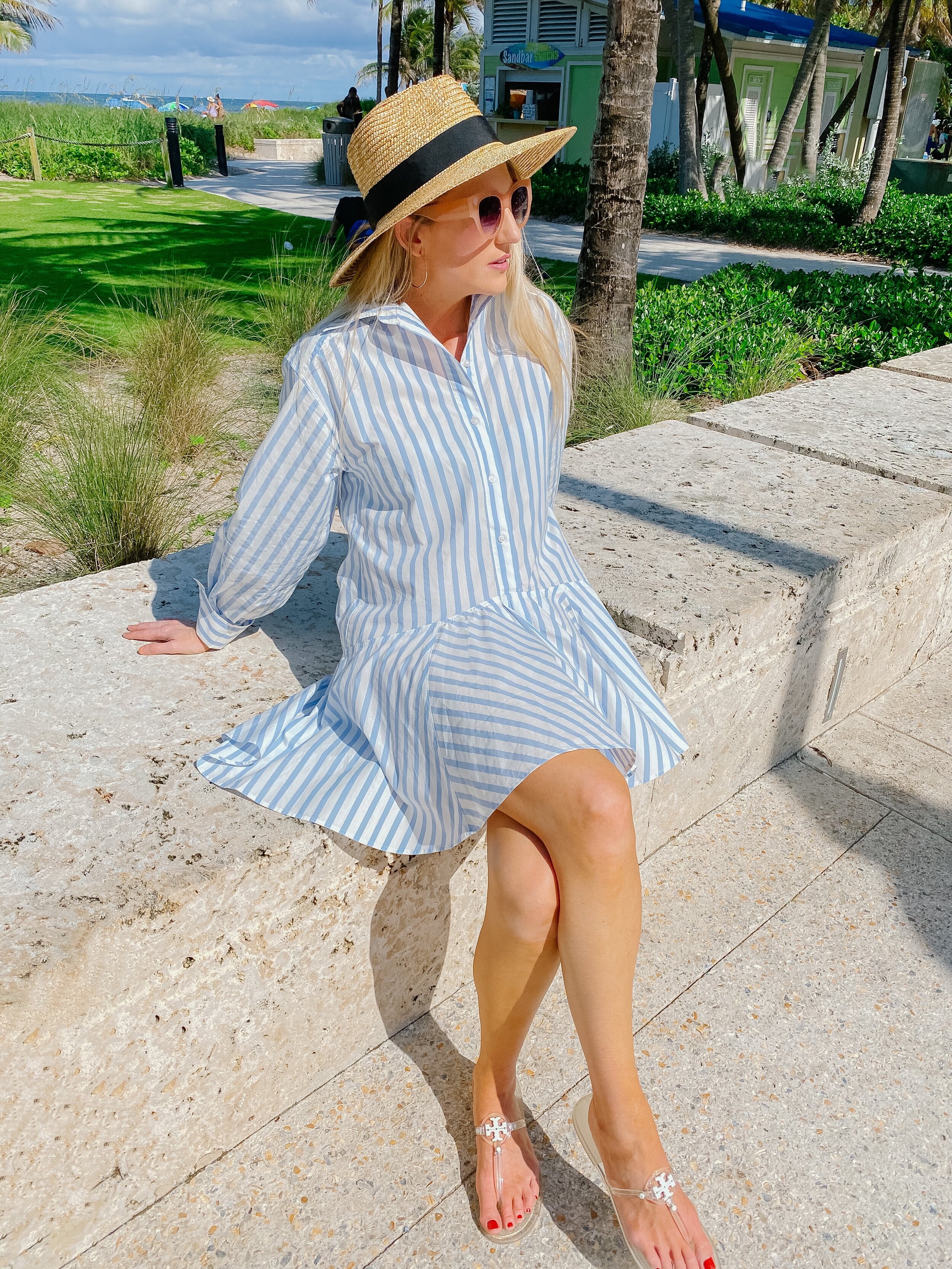 blue and white striped shirt dress with straw boater hat
