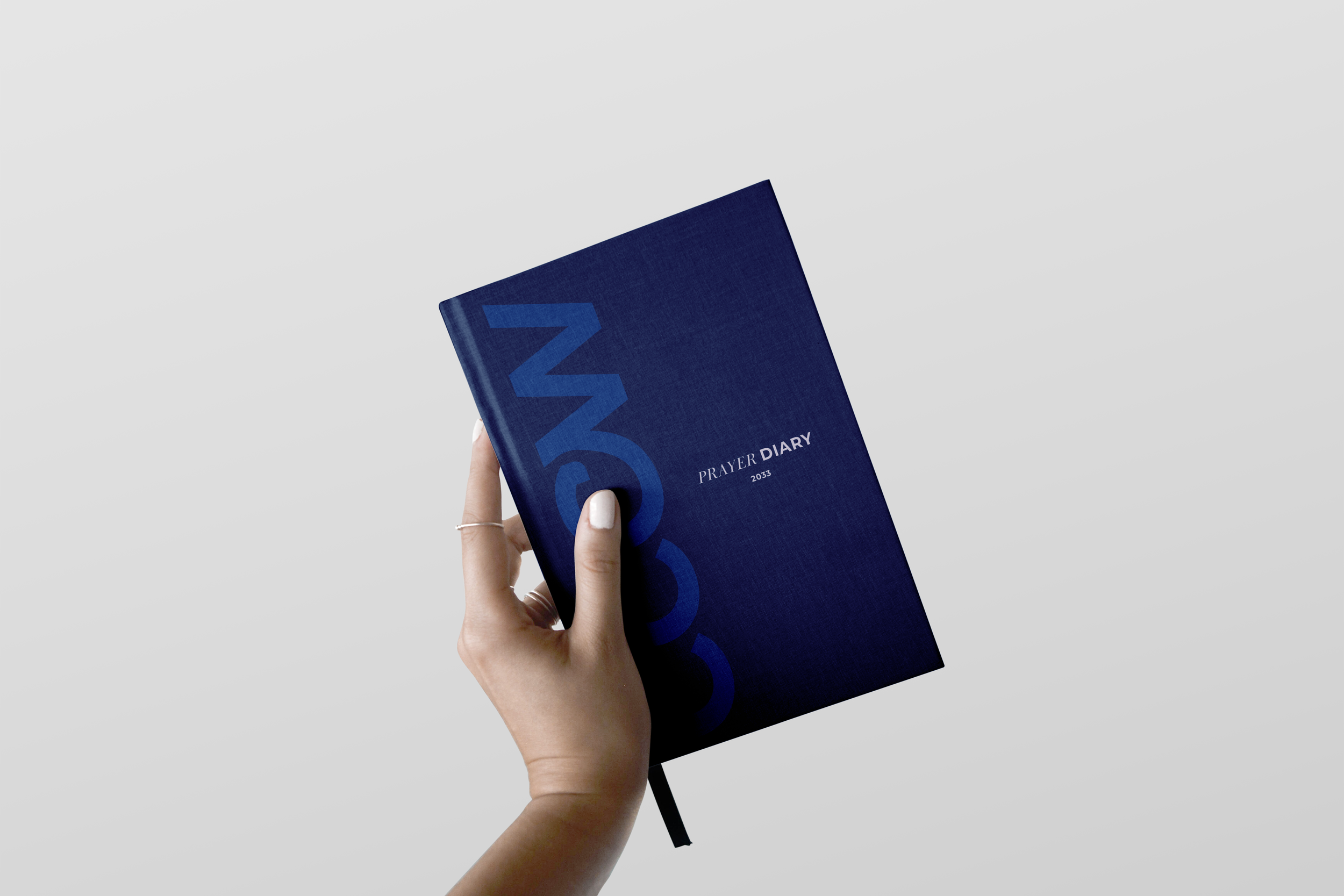 CCCW Hard Cover Notebook with Hand Mockup.png