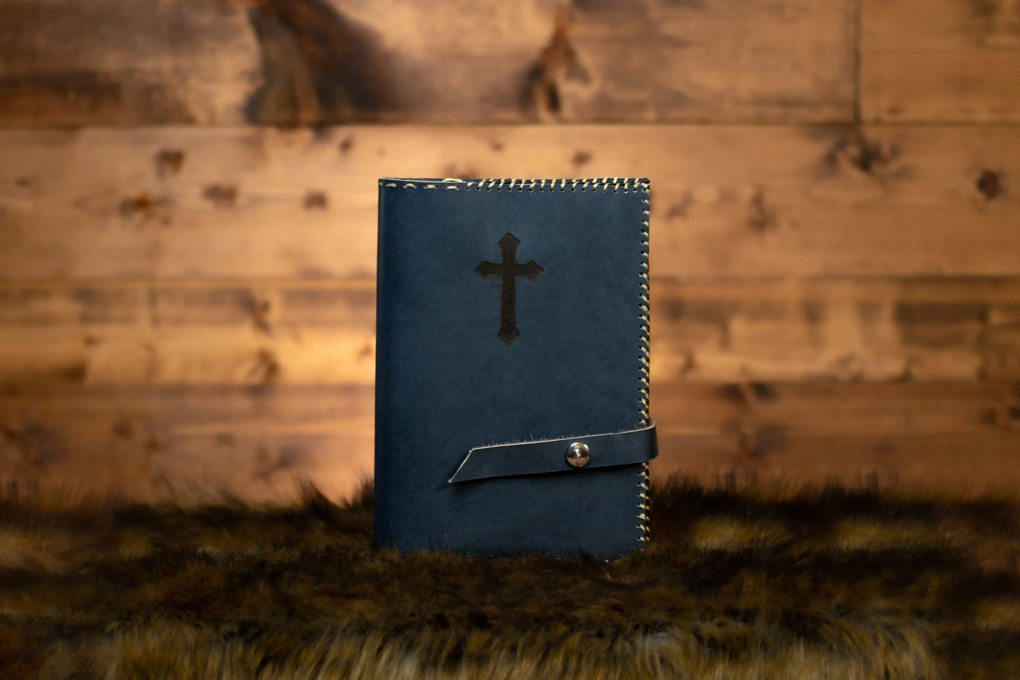 Deep blue leather cover on rustic background