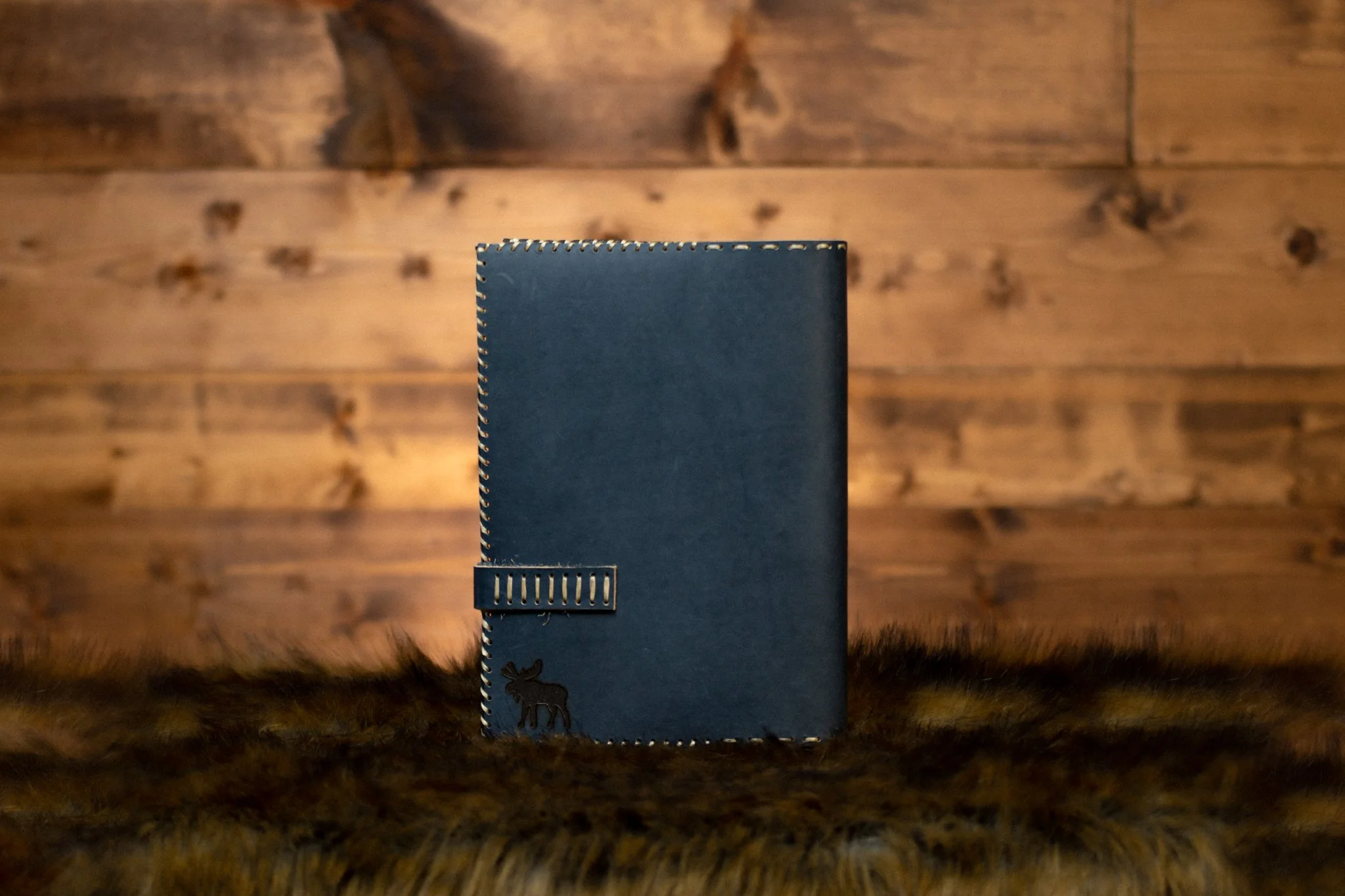 Beautiful handmade leather bible cover on rustic background