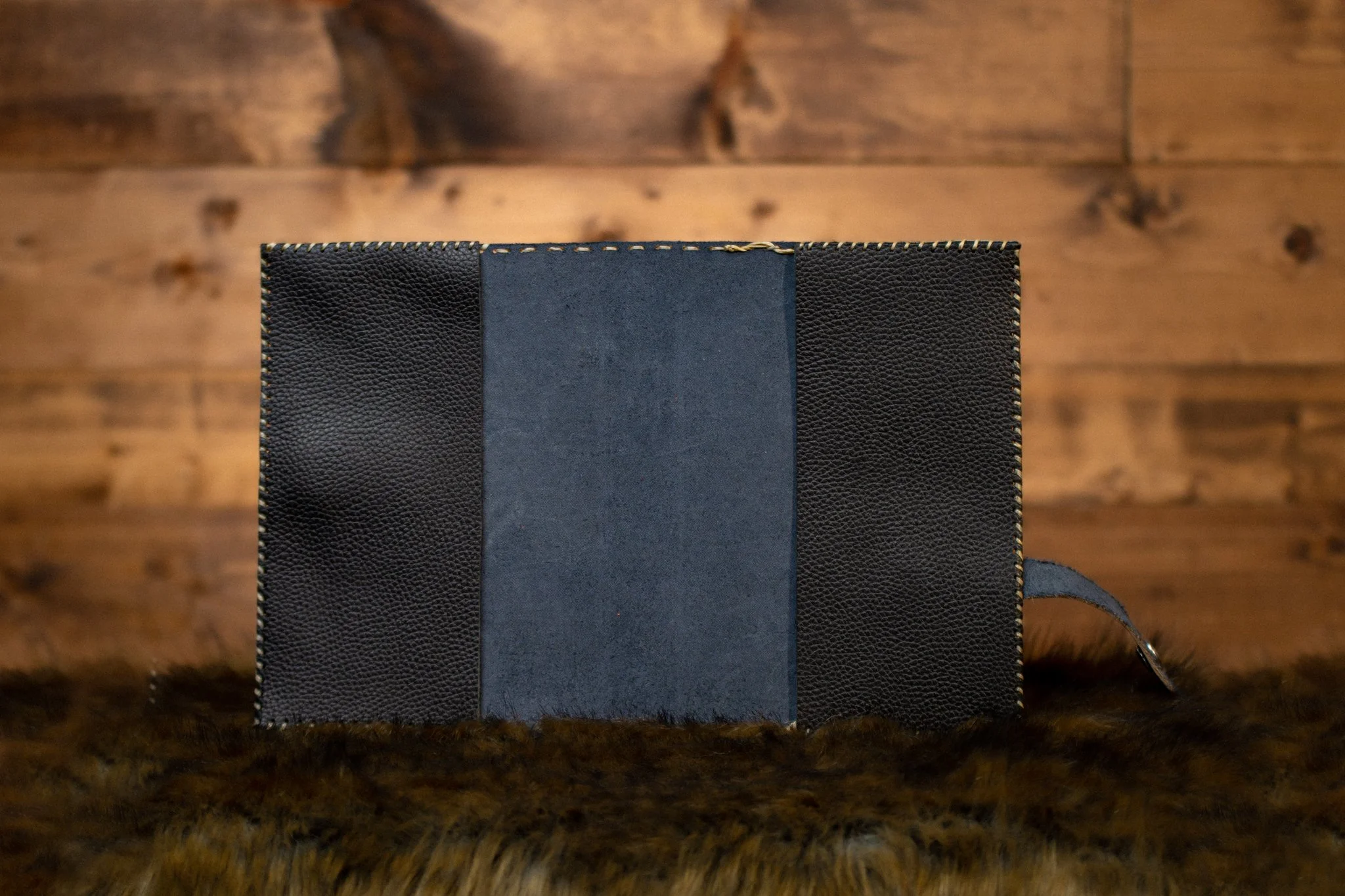 inside flaps of blue leather cover on rustic background