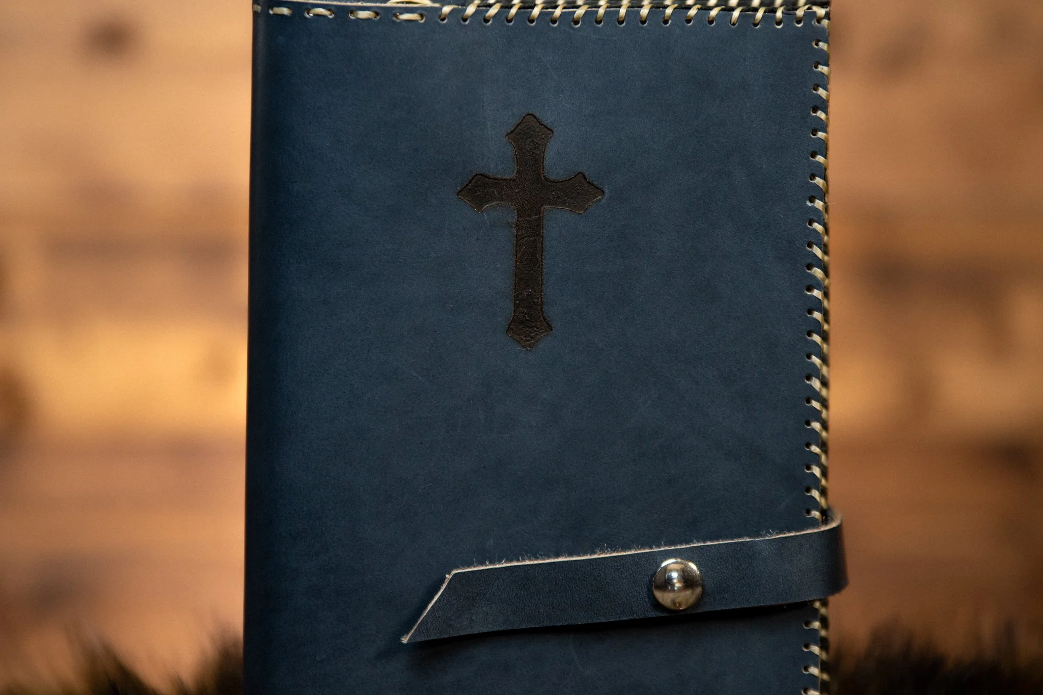Stunning blue leather cover with cross and silver button