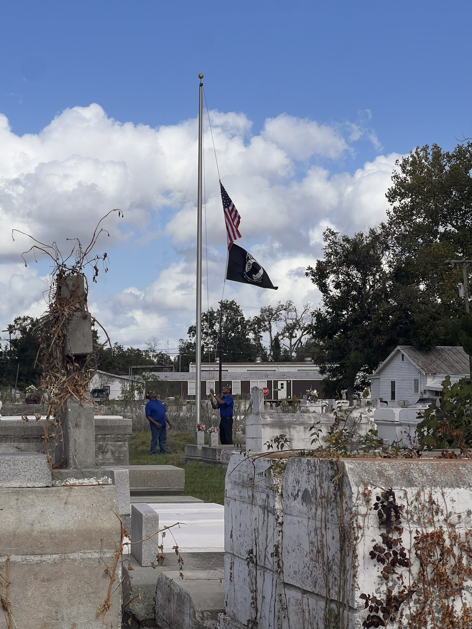  Mr. Joe Evans and Mr. Warren White raise the flag. Courtesy of Patricia Wesley. 