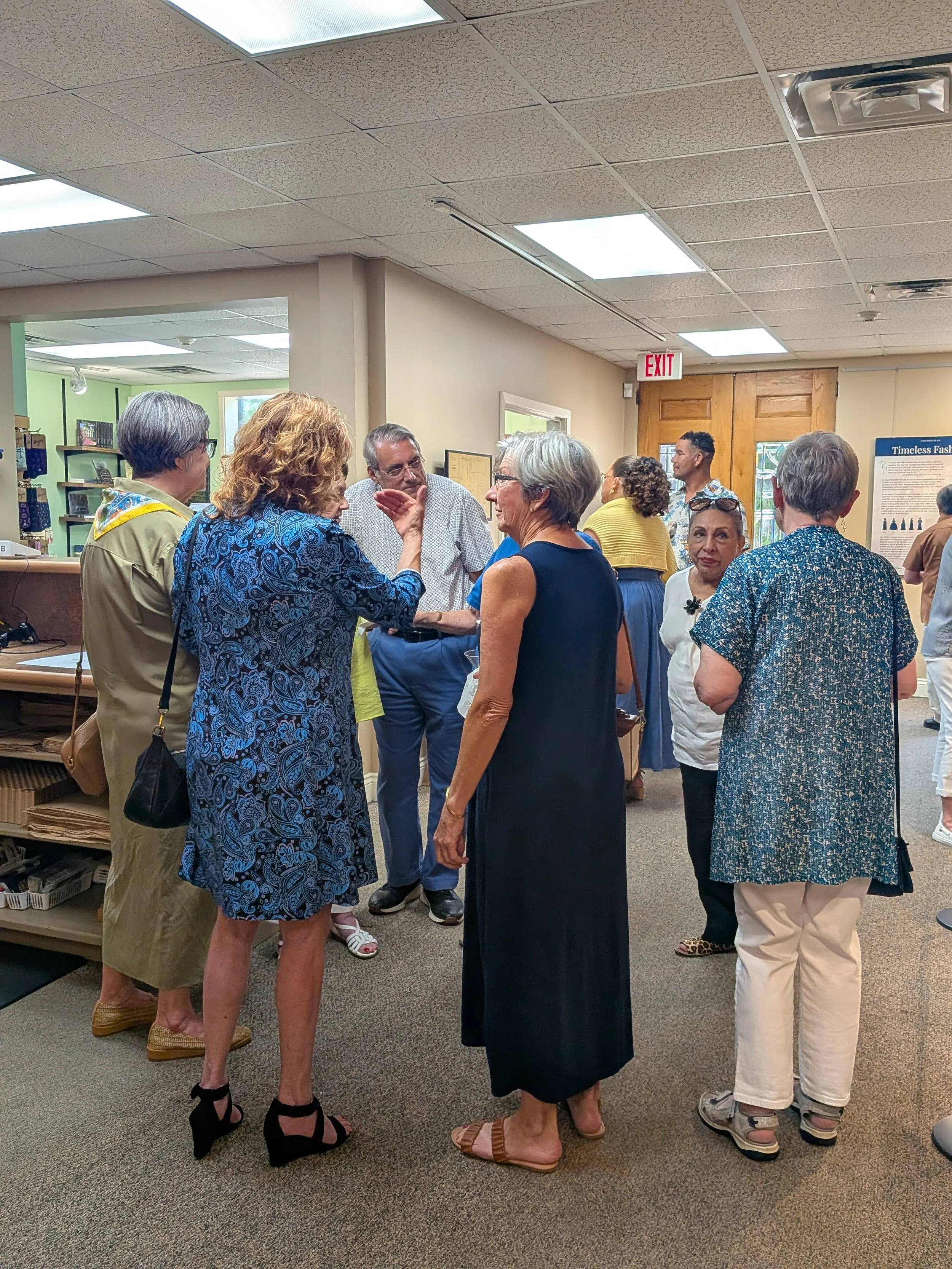  Members mingle during the opening. 