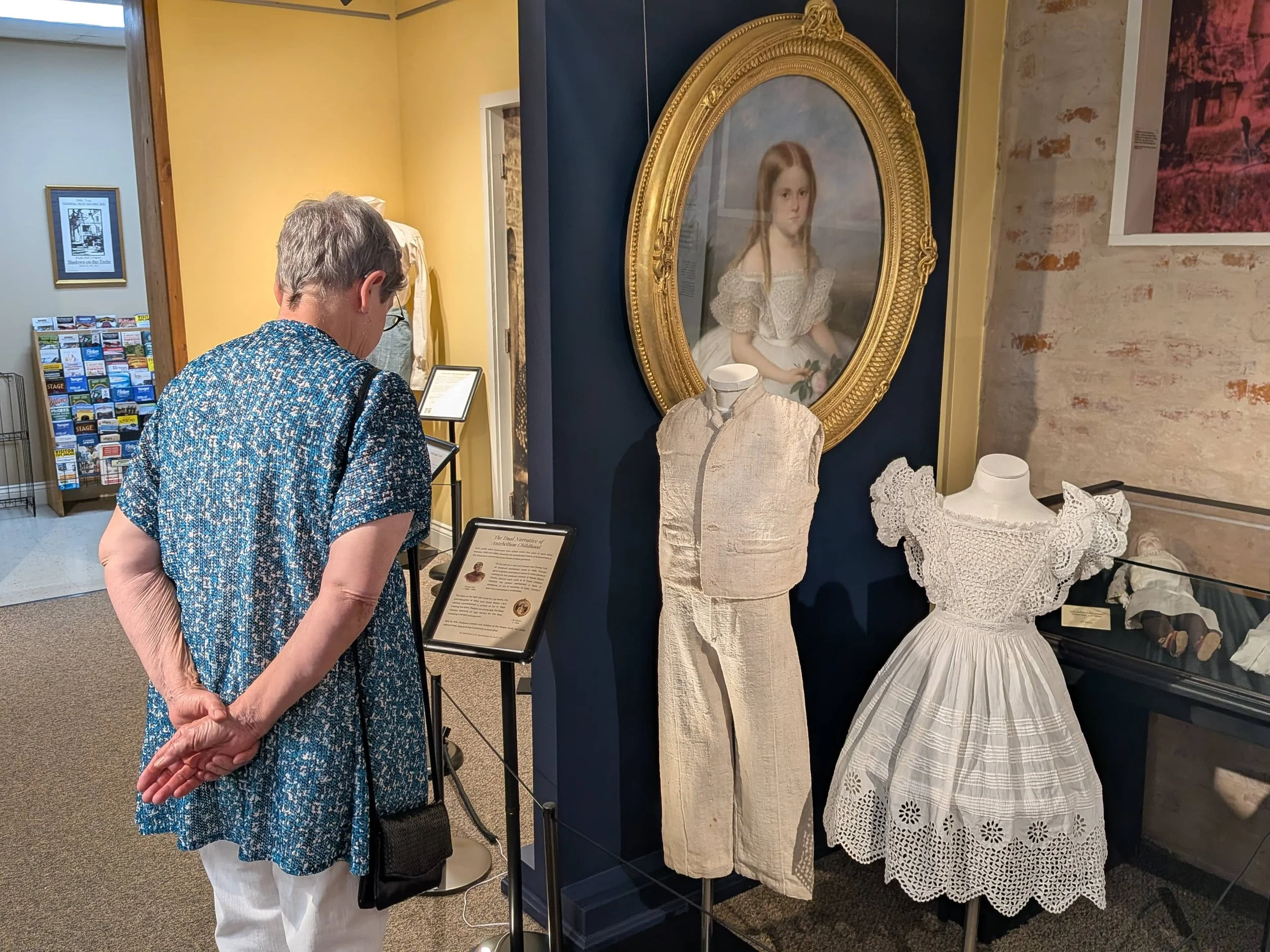  Charleen Markle views the children’s clothing. 